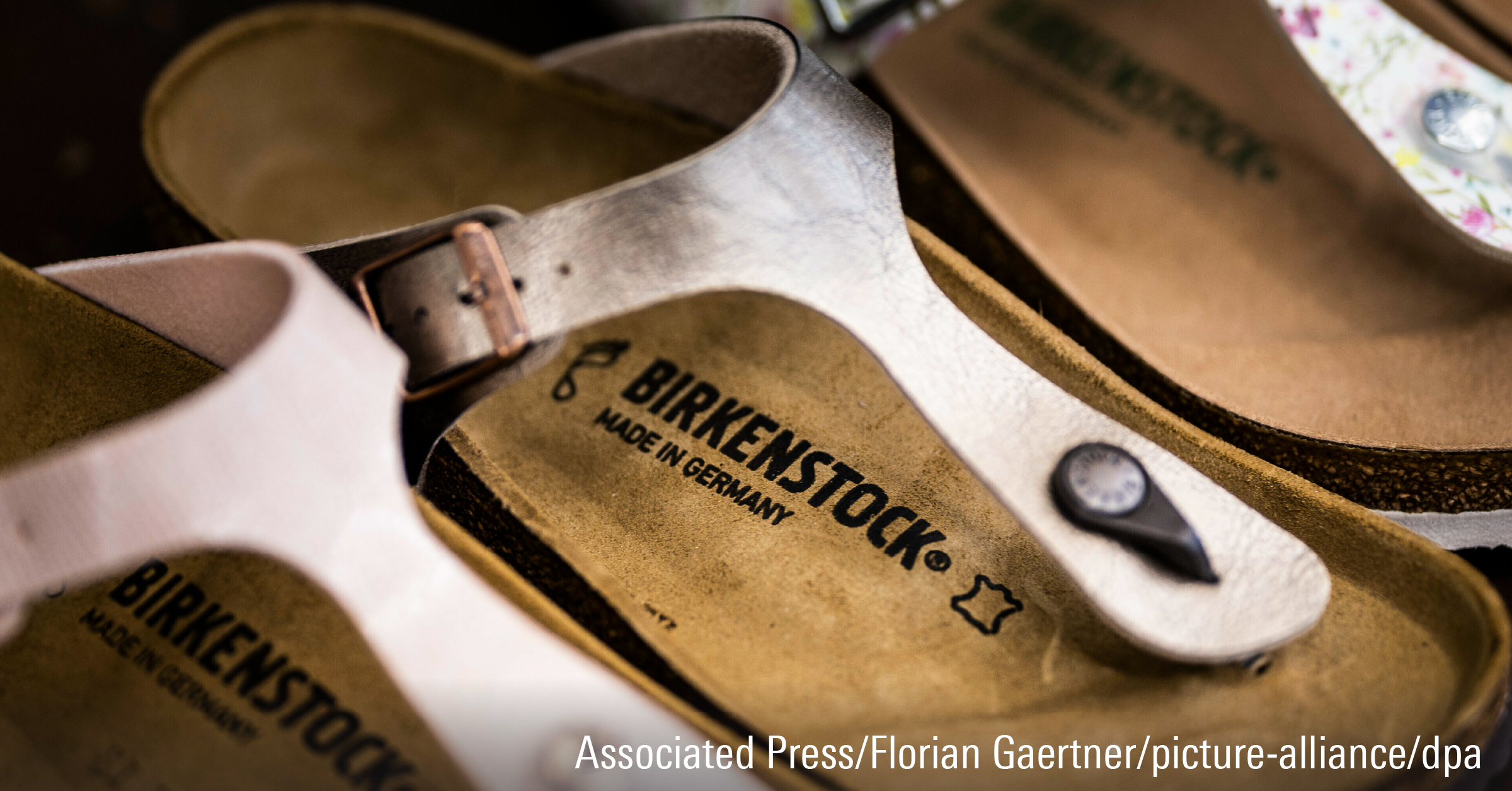 The Birkenstock logo on a shoe.