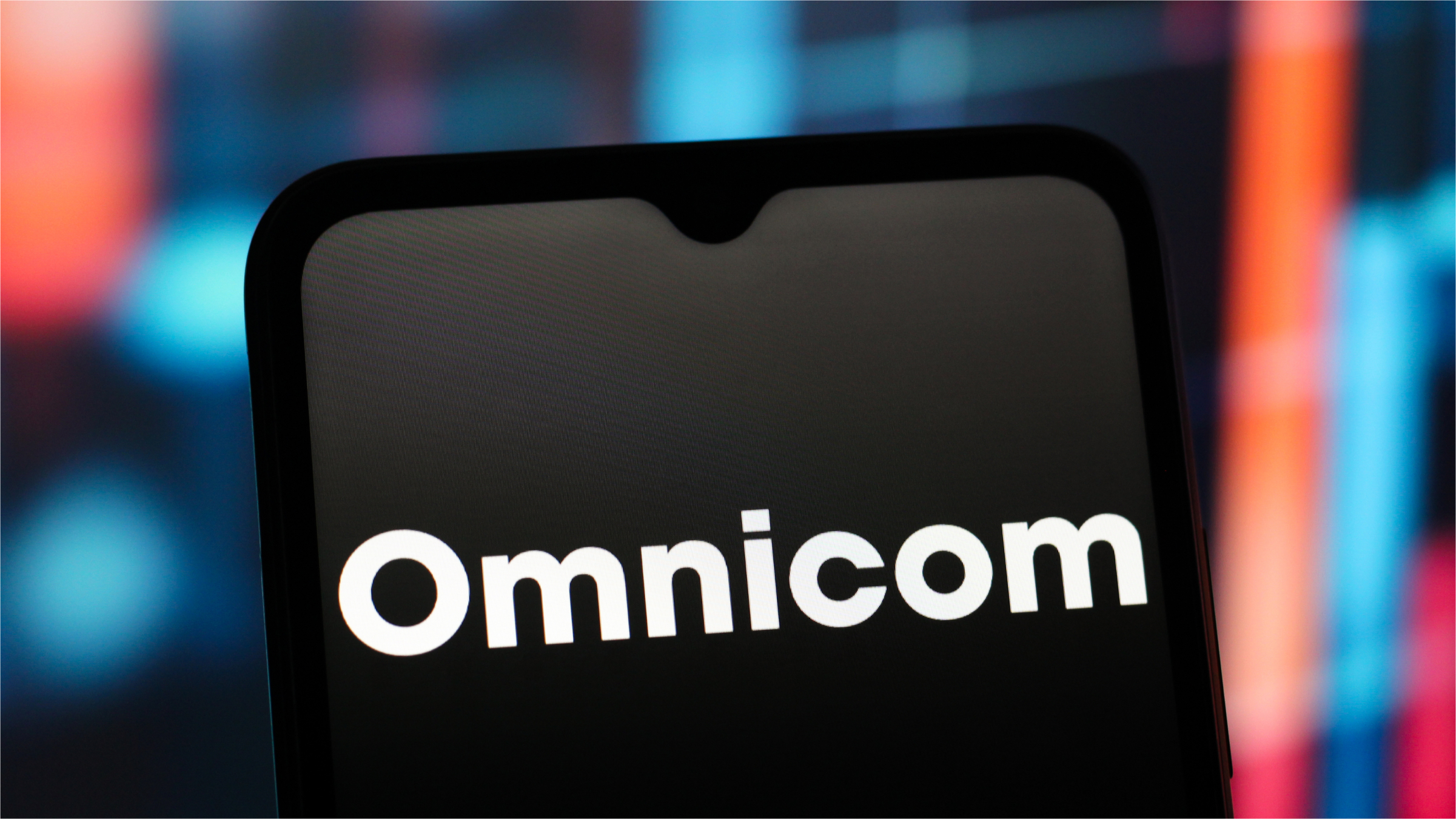In this photo illustration, the Omnicom Group logo is seen displayed on a smartphone screen.