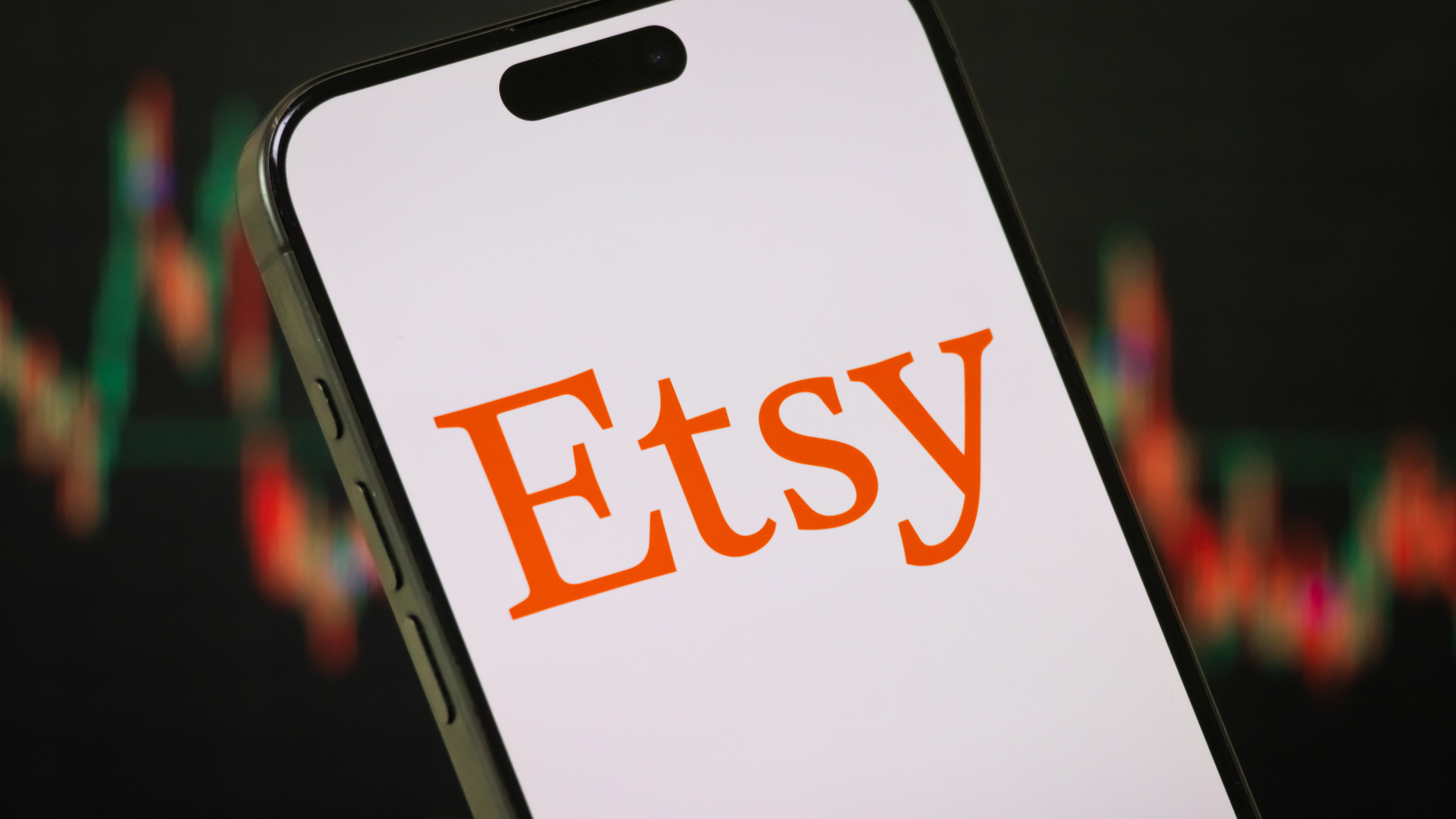 The Etsy logo is displayed on a smartphone screen.