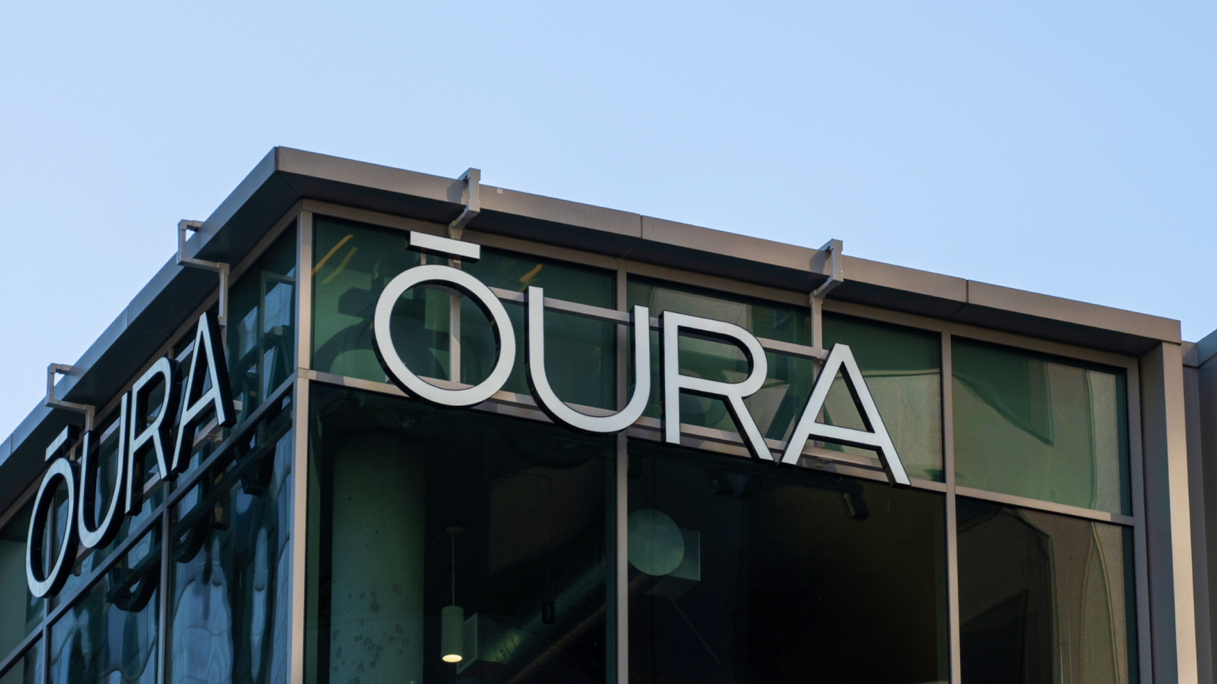 Oura corporate signage on the glass facade.