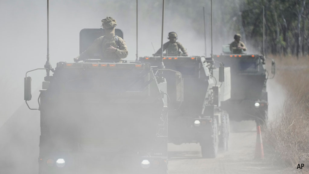 Australian defence force drive their High Mobility Artillery Rocket System for firing during Exercise Talisman Sabre 2025, Australia's largest-ever war fighting drills at Shoalwater Bay Training Area, near Rockhampton, Australia, Monday, July 14, 2025. (AP Photo/Rick Rycroft)