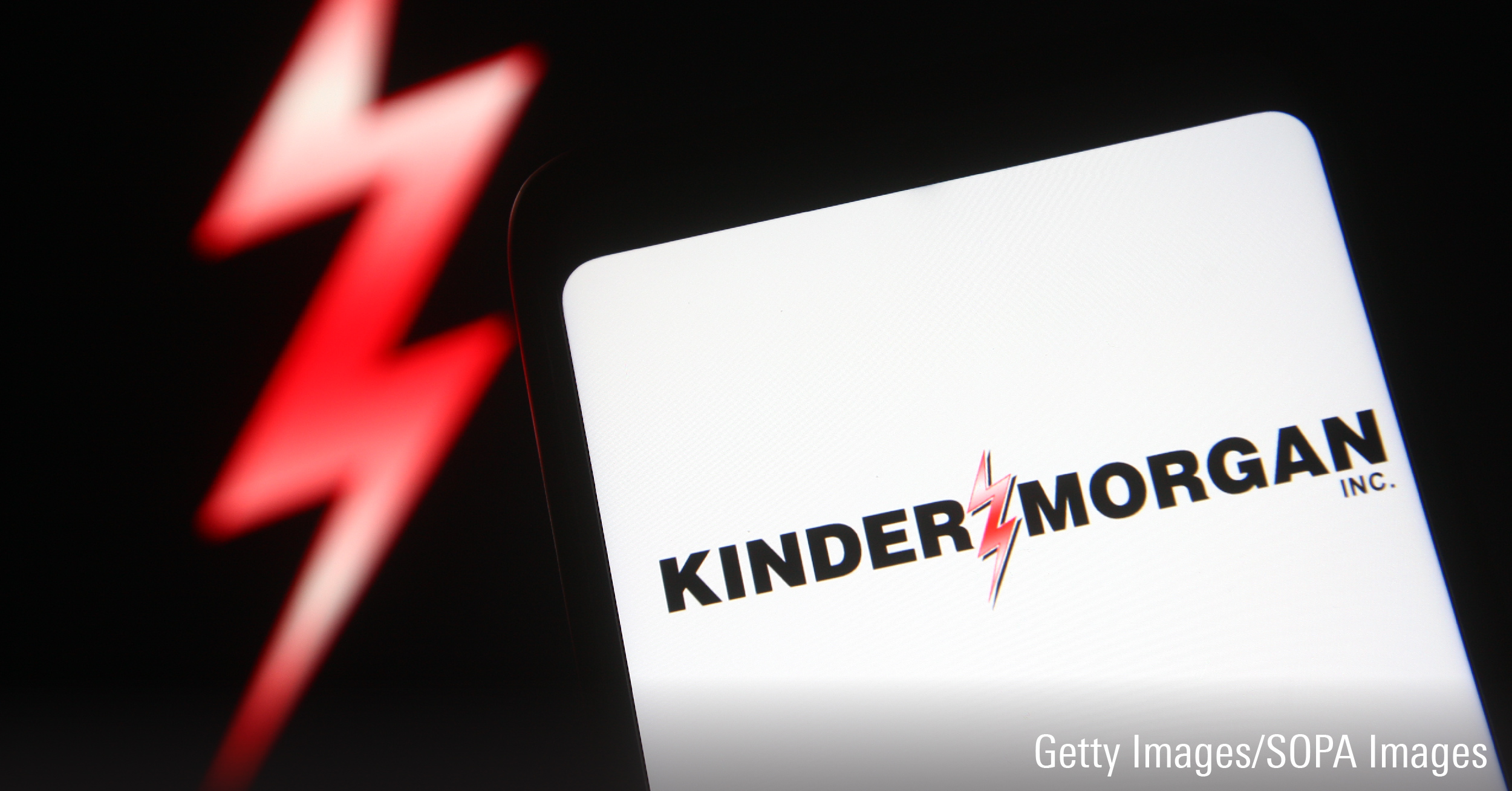 In this photo illustration a Kinder Morgan logo is seen on a smartphone screen.