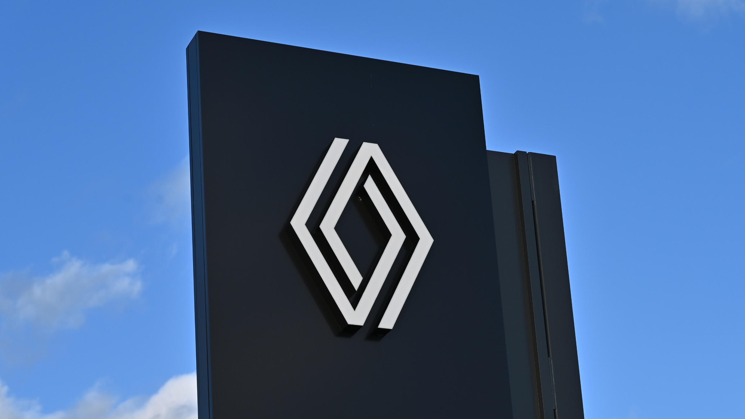 A general view of Renault logo on a dealership showroom sign.
