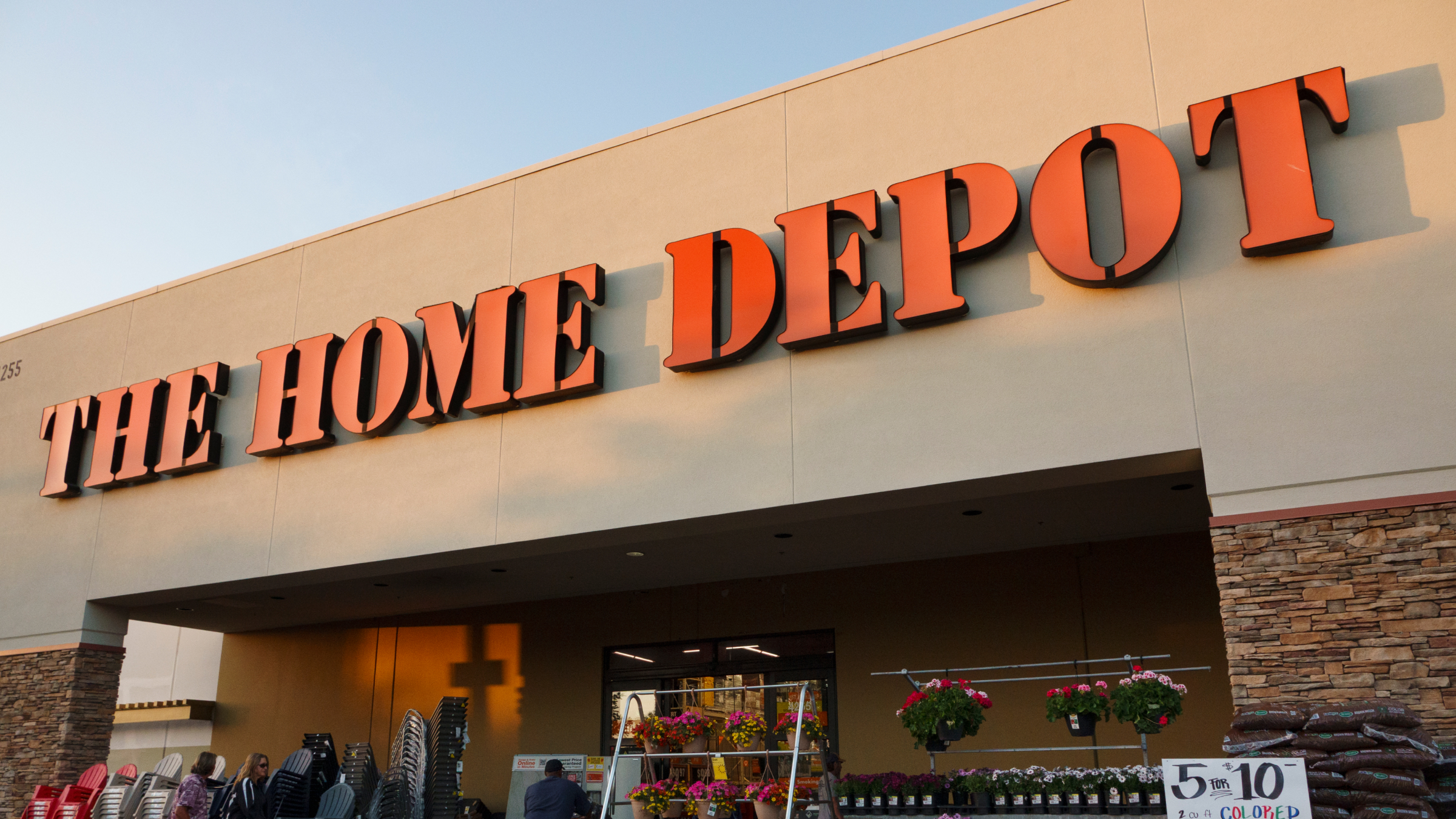 A Home Depot logo is displayed on a sign outside of a store.
