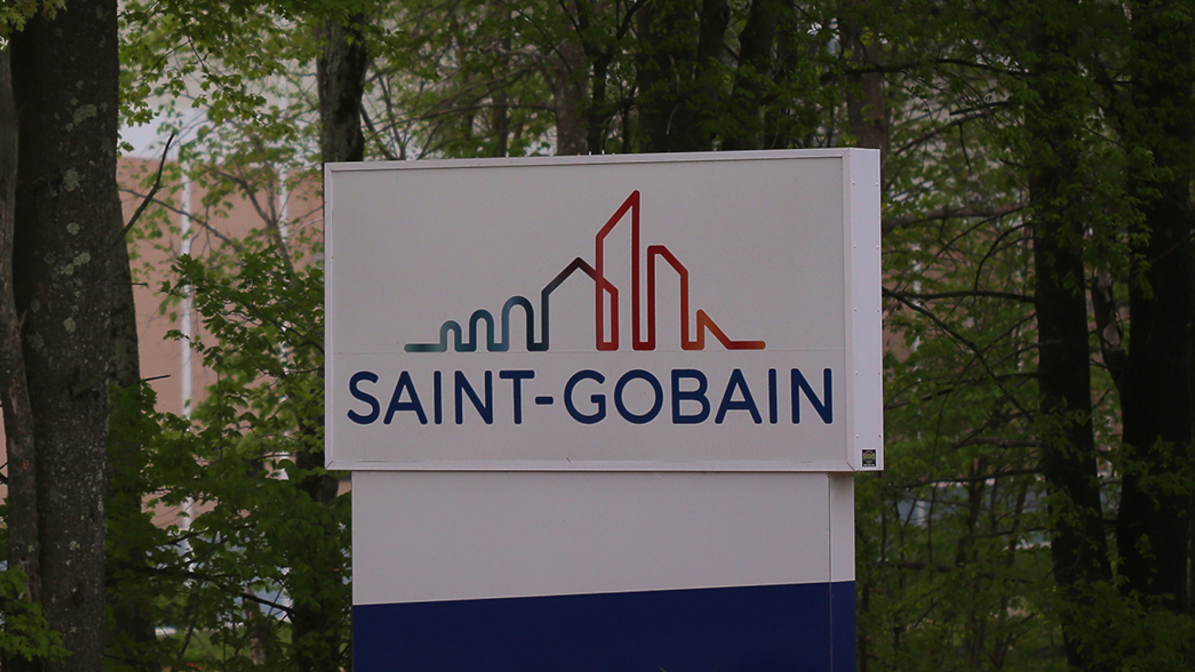 The Saint-Gobain logo at a anufacturing plant.