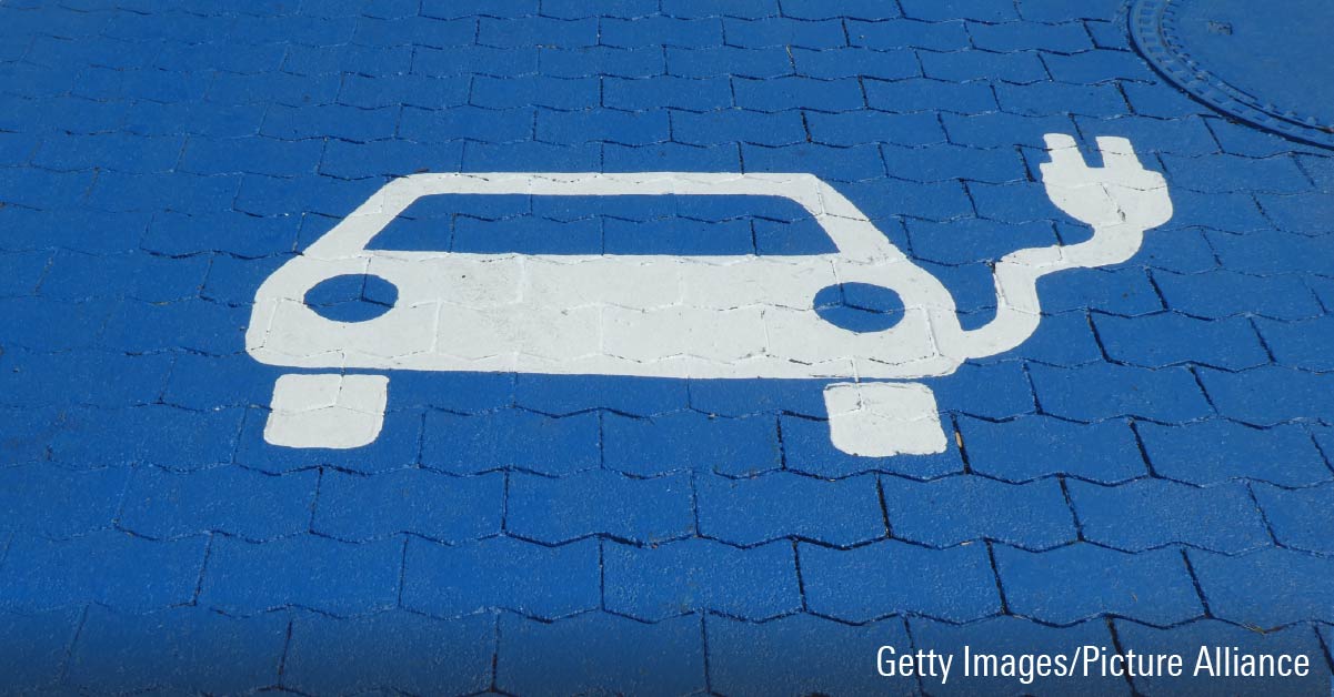 Pictogram with symbol on blue background for charging station at a fast charging station for electric cars.