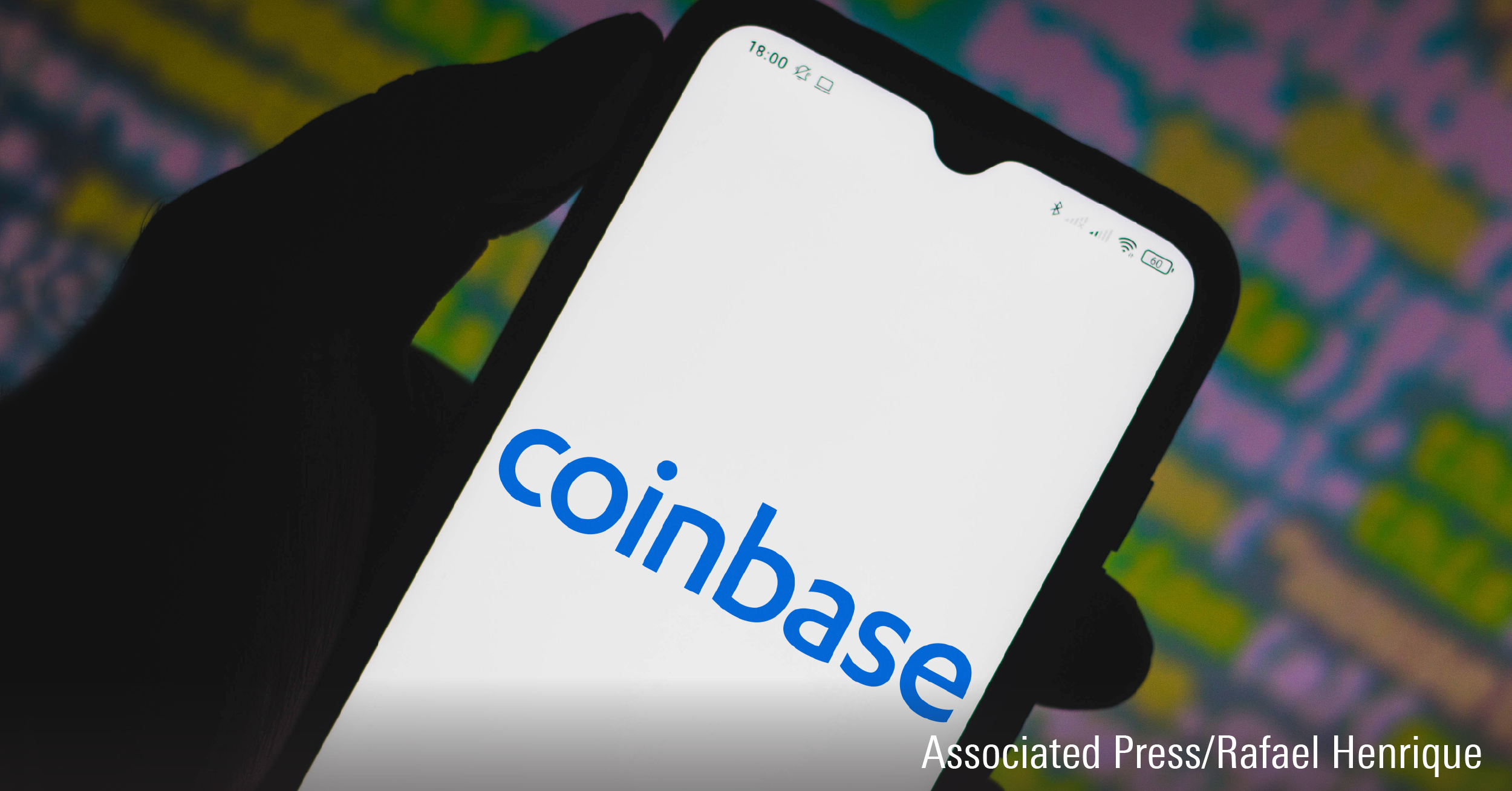 In this photo illustration a Coinbase logo seen displayed on a smartphone.