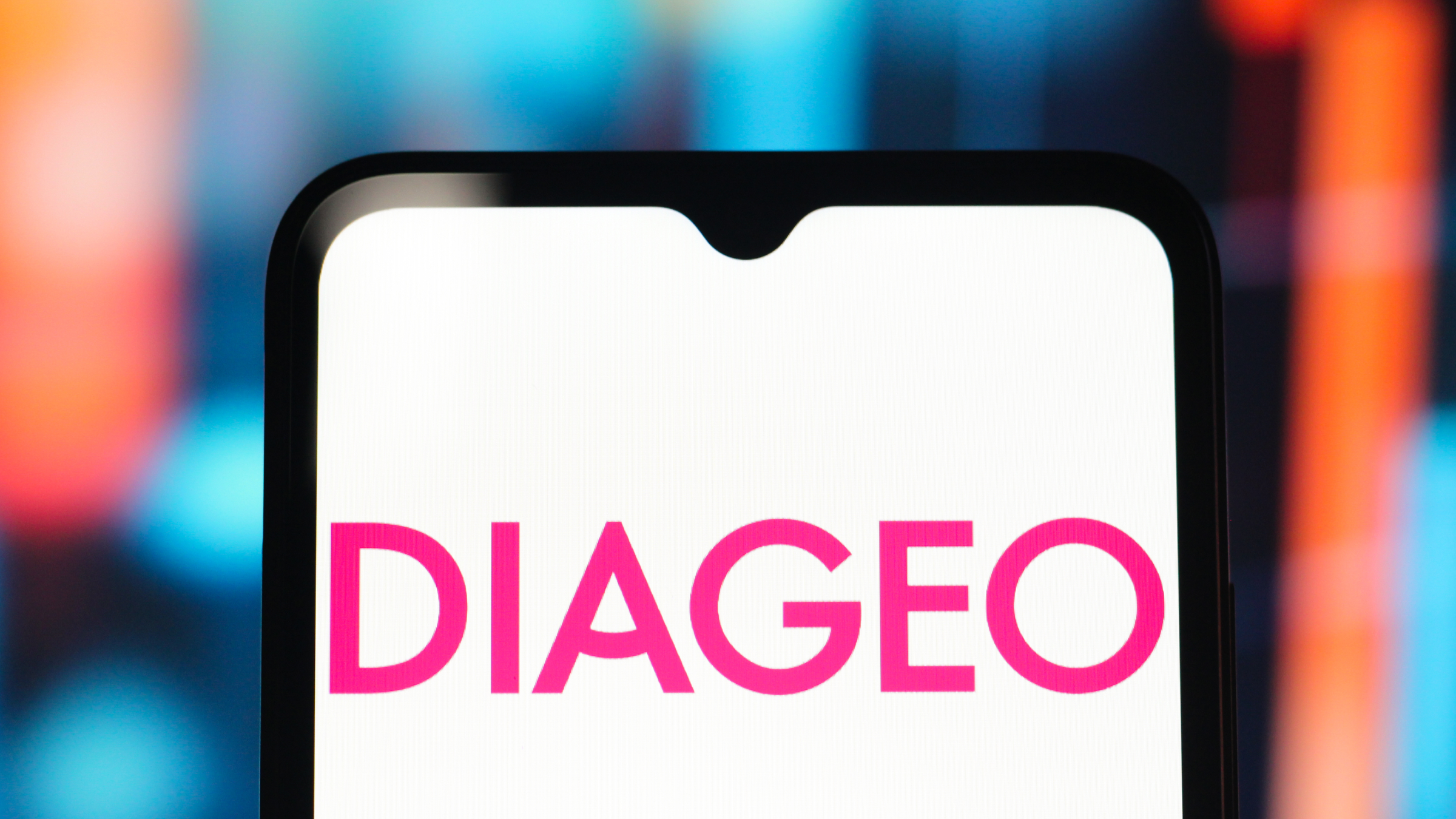 The Diageo logo is seen displayed on a smartphone screen.