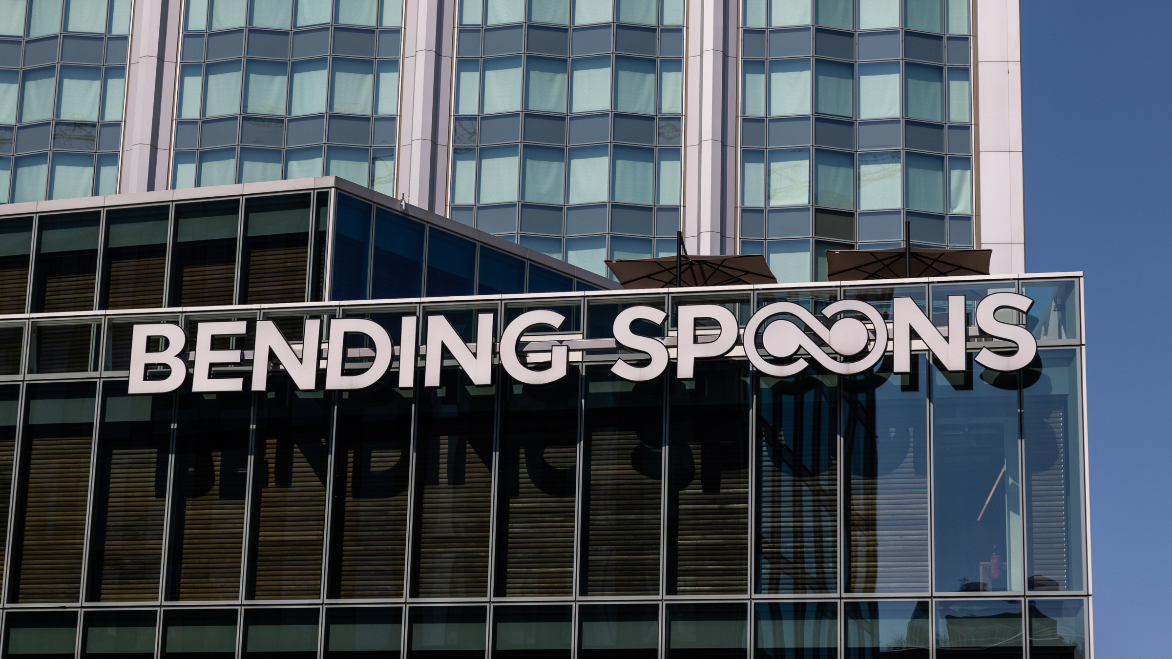 The logo of Bending Spoon on an office building.