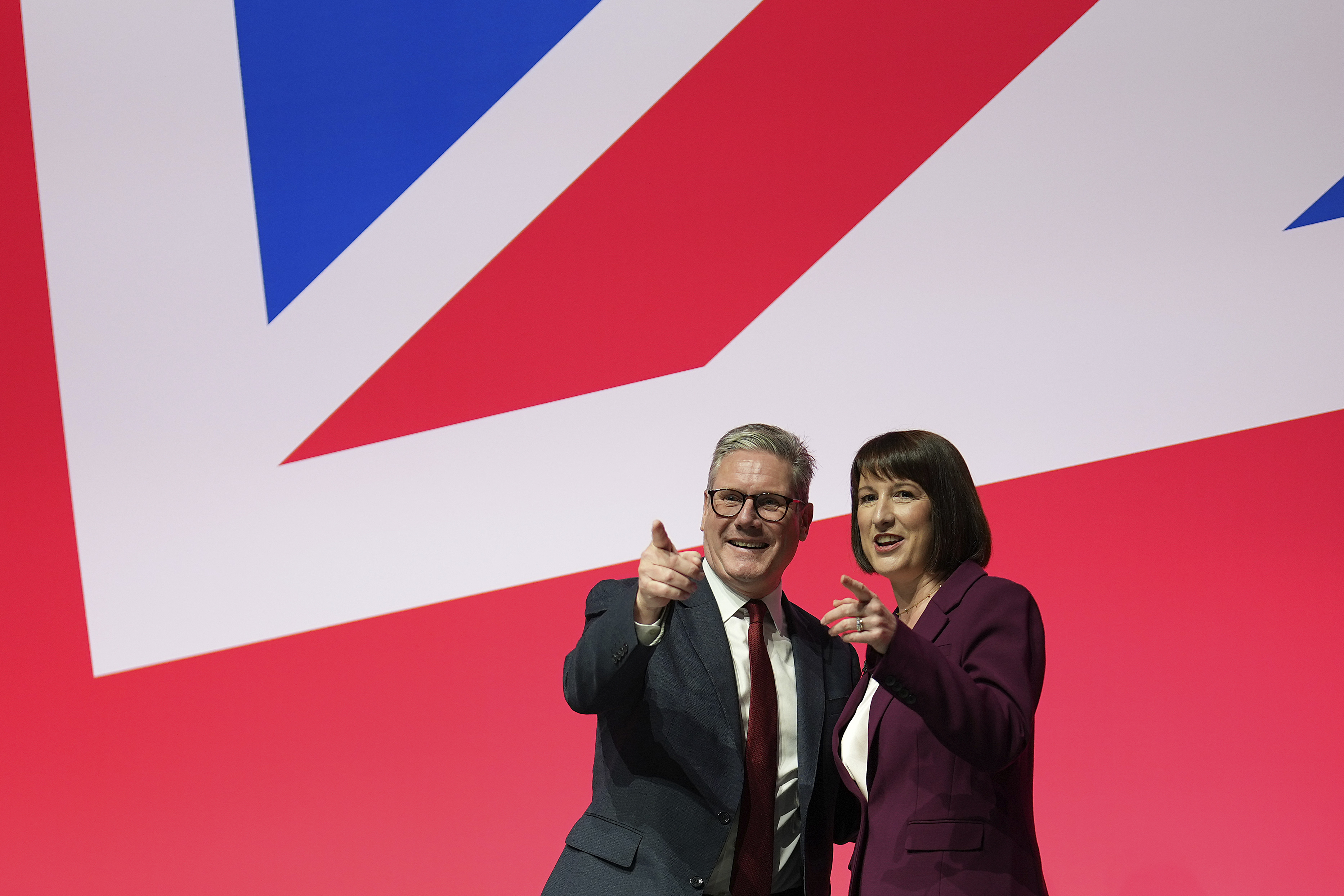 Britain's Prime Minister Keir Starmer and Britain's Chancellor of the Exchequer Rachel Reeves gesture after her speech at the Labour Party Conference in Liverpool, England, Monday, Sept. 23, 2024.