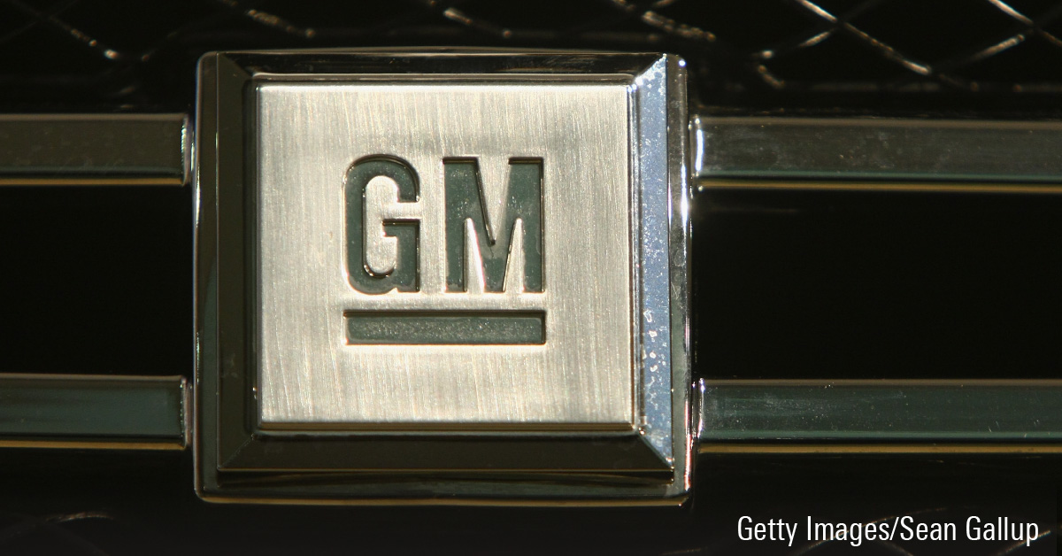 General Motors logo superimposed on the front grille of a General Motors car.