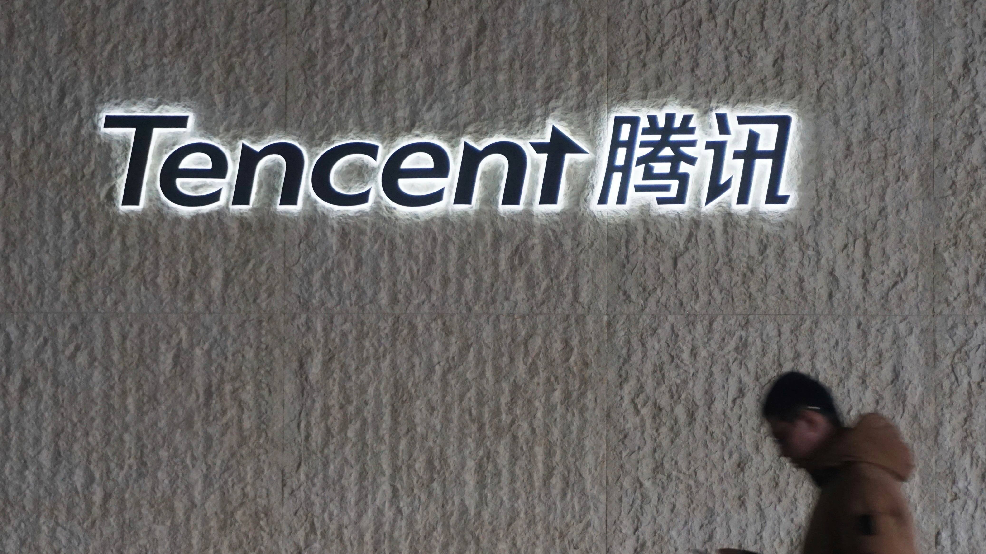 A man walks at the regional headquarters of Tencent Group in Shanghai, China Thursday, Jan. 16, 2025. Tencent disclosed it has fired over a hundred employees in 2024 during internal anti-corruption investigations.