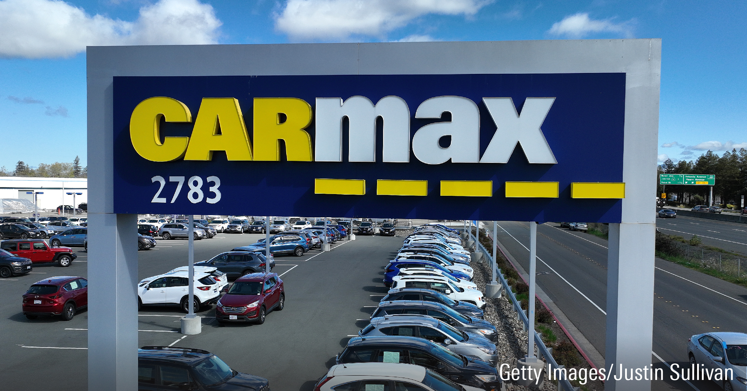 In an aerial view, cars are displayed on the sales lot at a CarMax dealership on April 11, 2023 in Santa Rosa, California.
