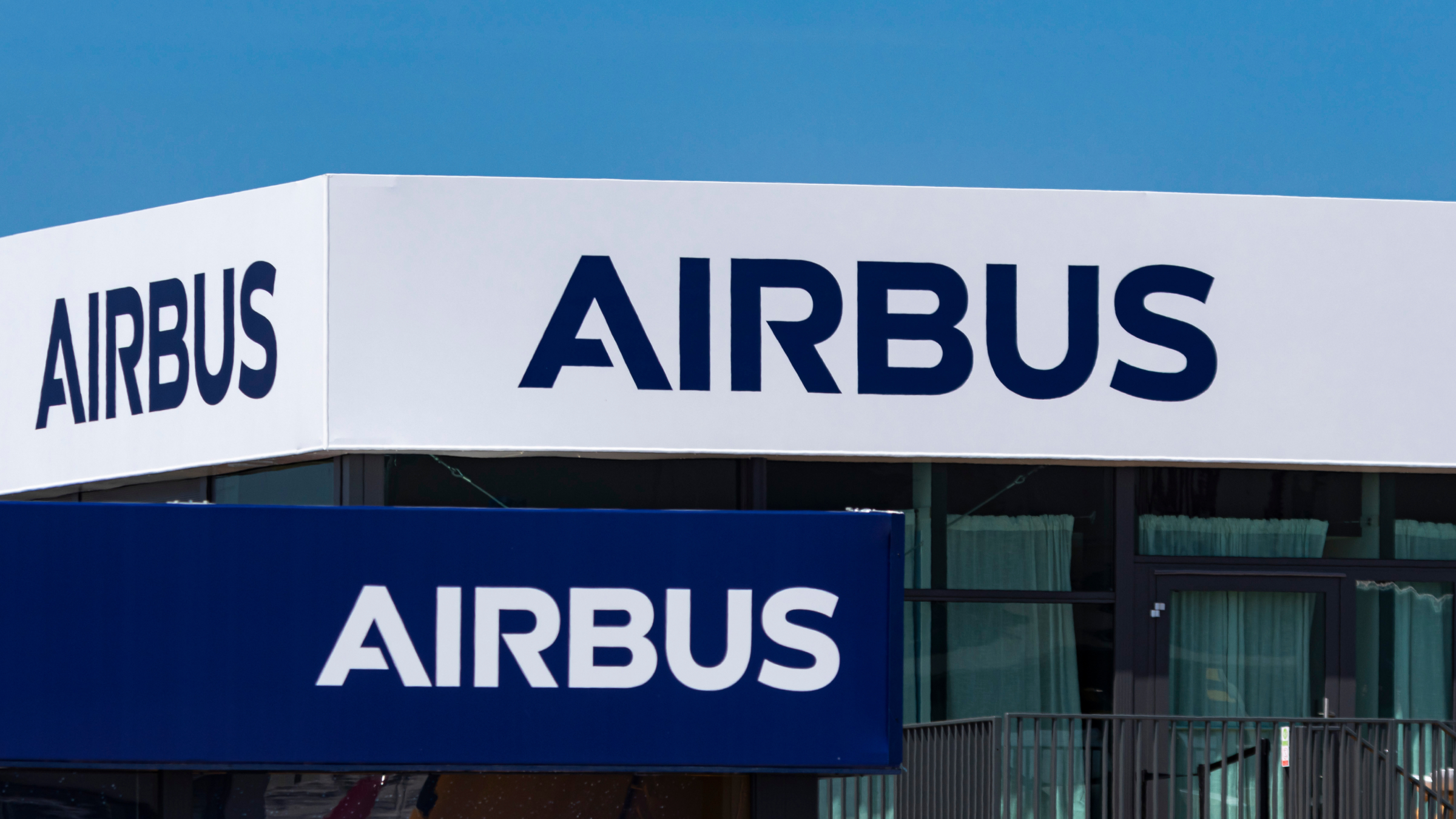 Closeup of the logo of Airbus displayed on a pavilion.