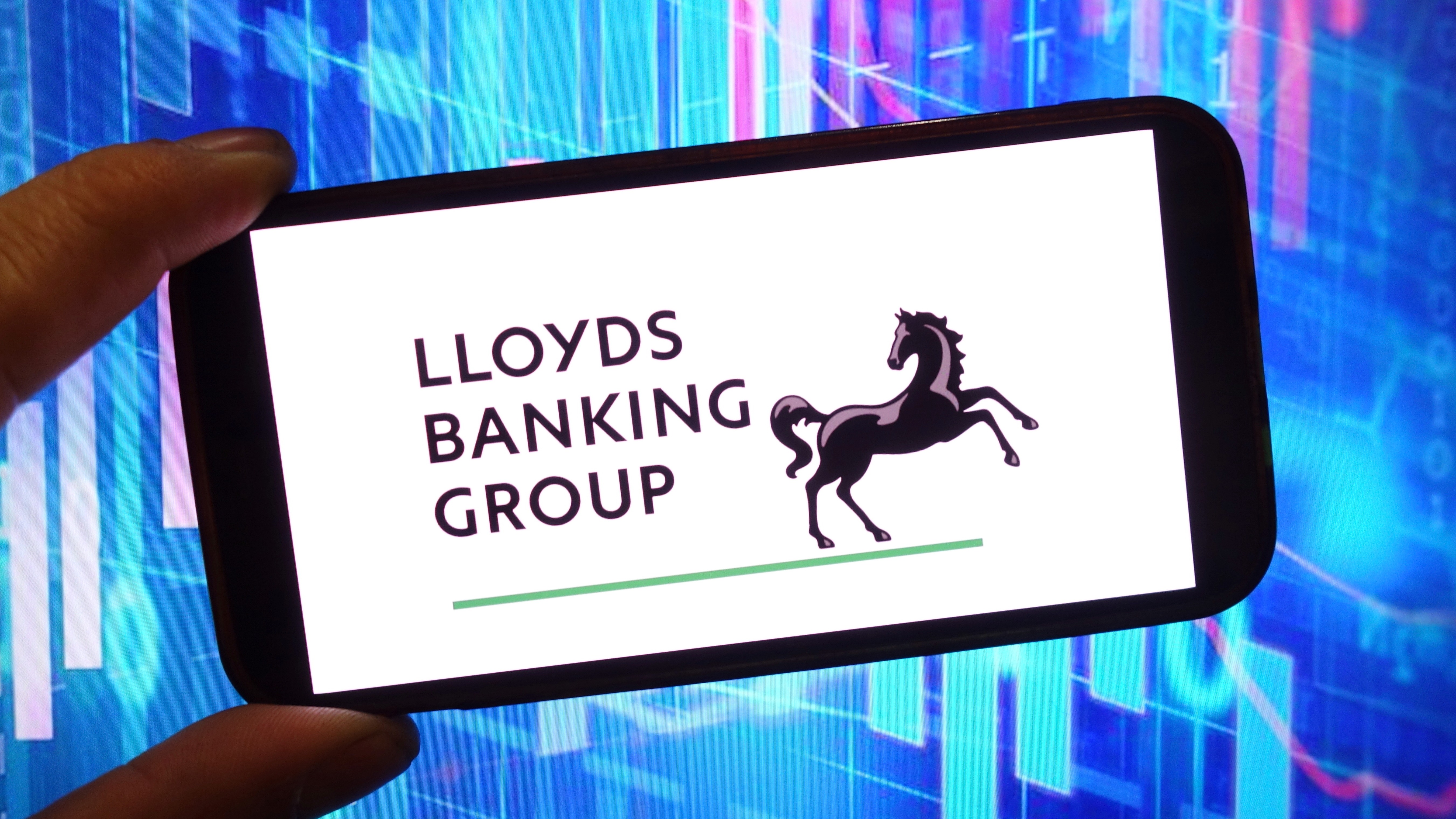 In this photo illustration, the Lloyds Banking Group company logo is seen displayed on a smartphone screen. (Photo by Piotr Swat / SOPA Images/Sipa USA) *** Strictly for editorial news purposes only ***(Sipa via AP Images)