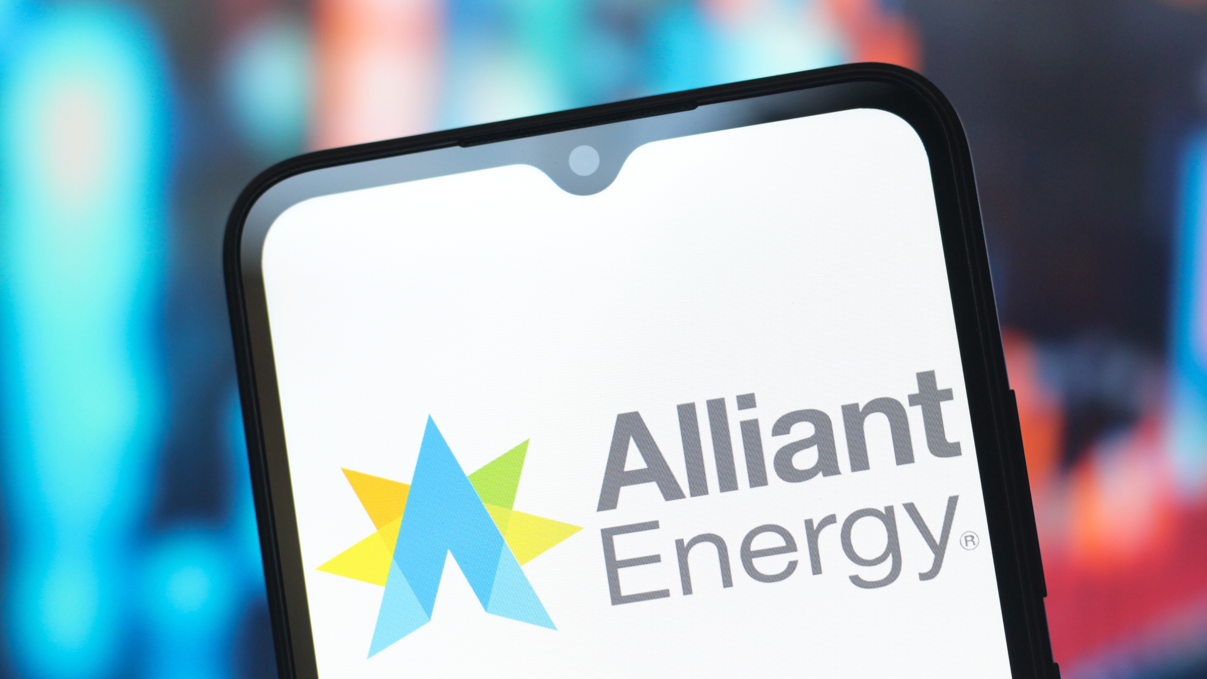 The Alliant Energy Corporation logo is seen displayed on a smartphone screen.