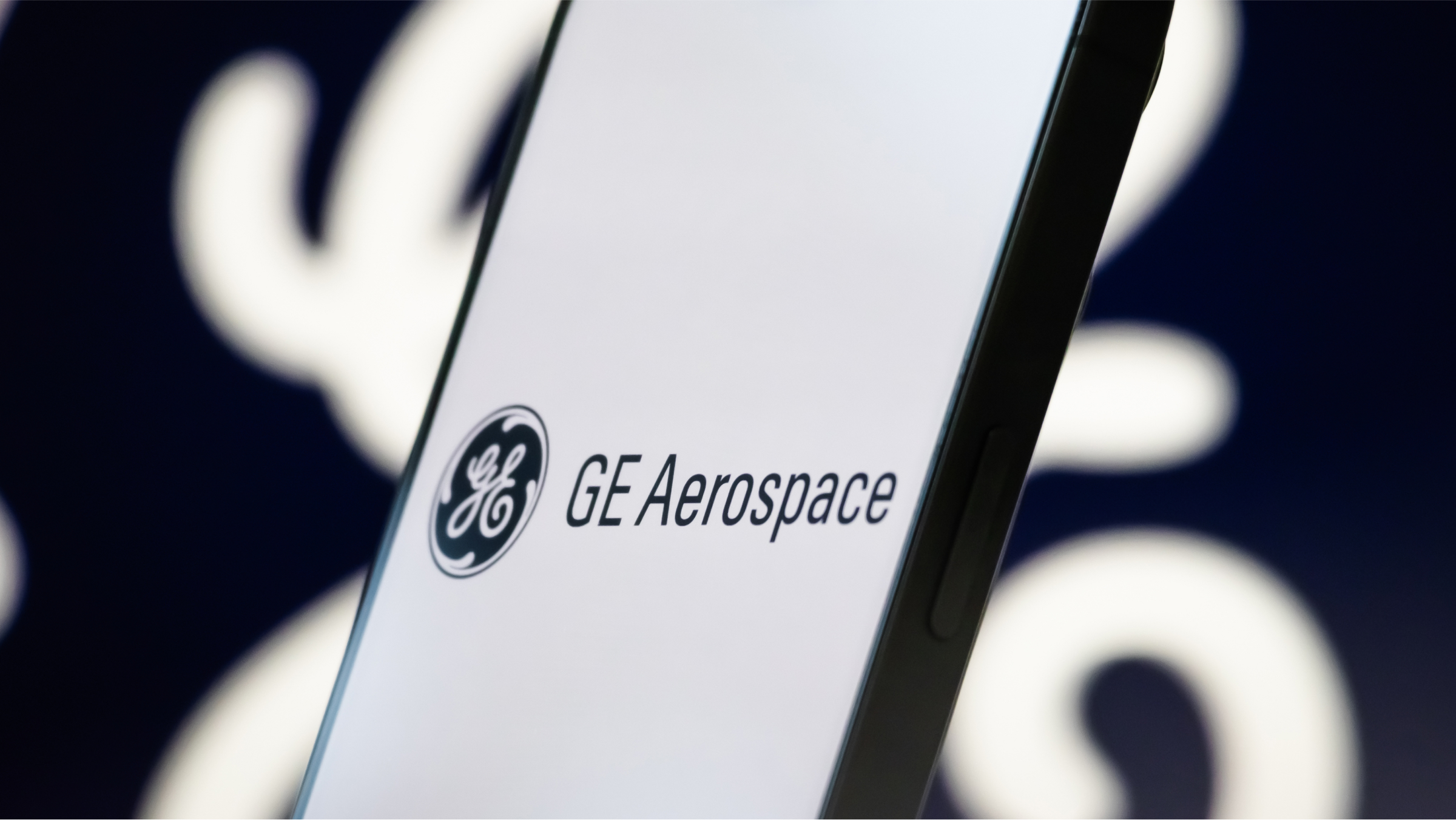 The GE Aerospace logo is displayed on a smartphone screen.