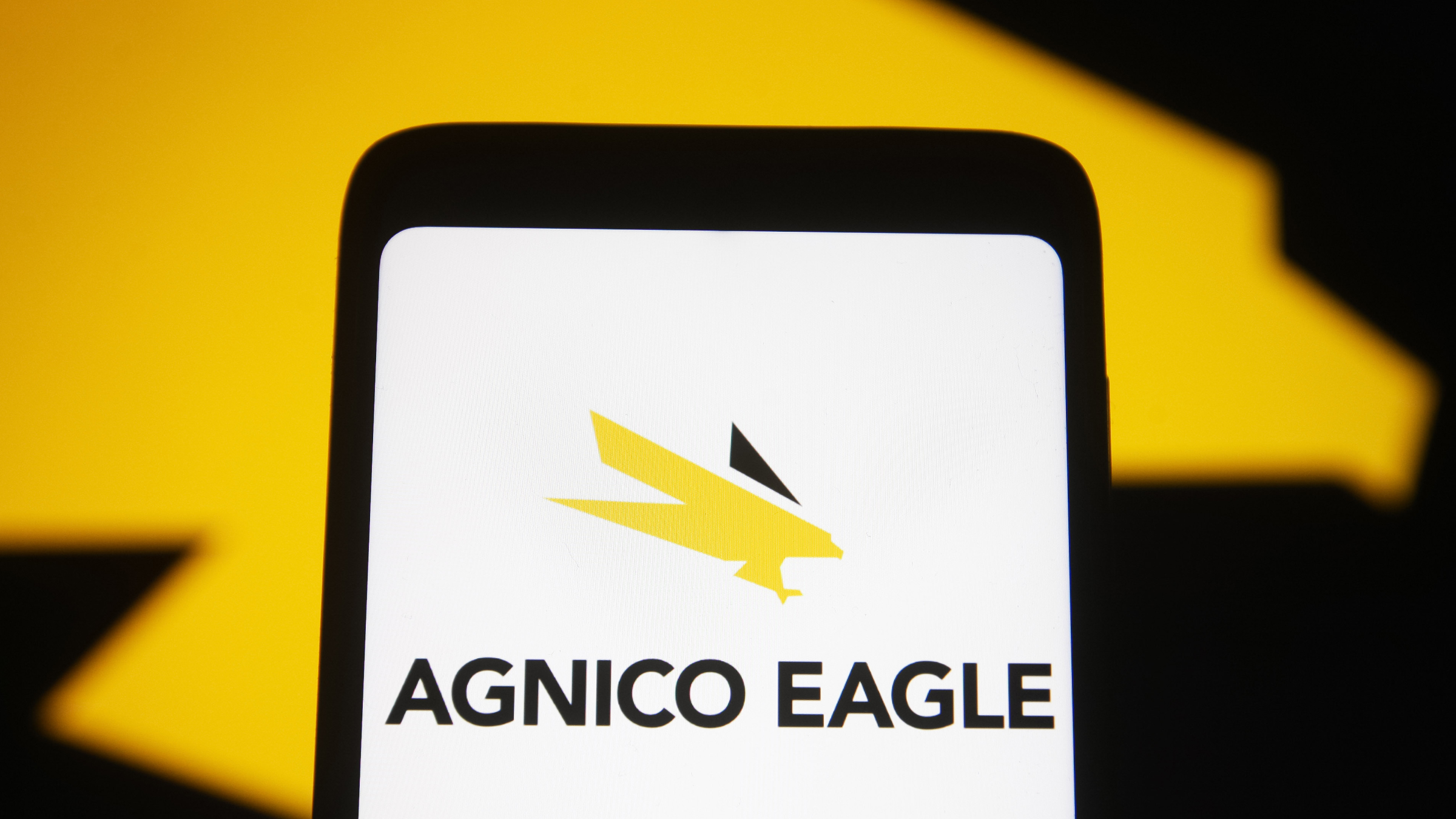 The Agnico Eagle Mines Limited logo is seen on a smartphone screen