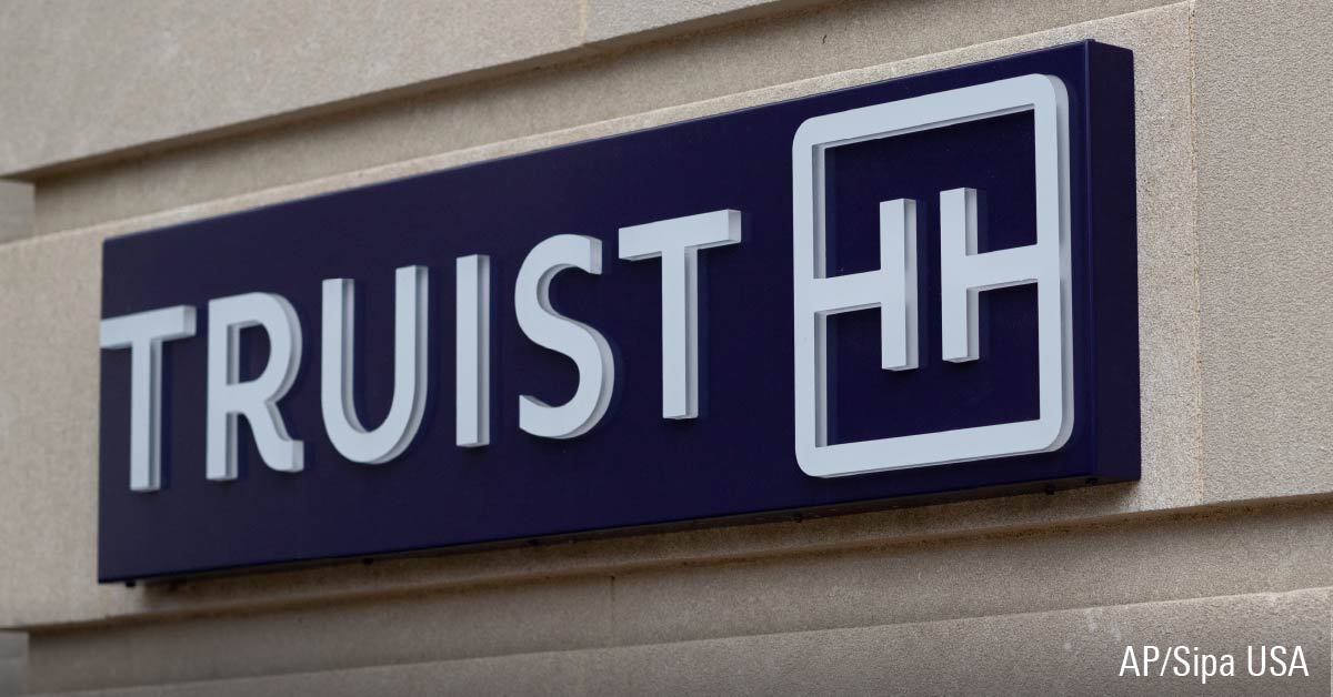 Truist logo sign displayed on storefront building