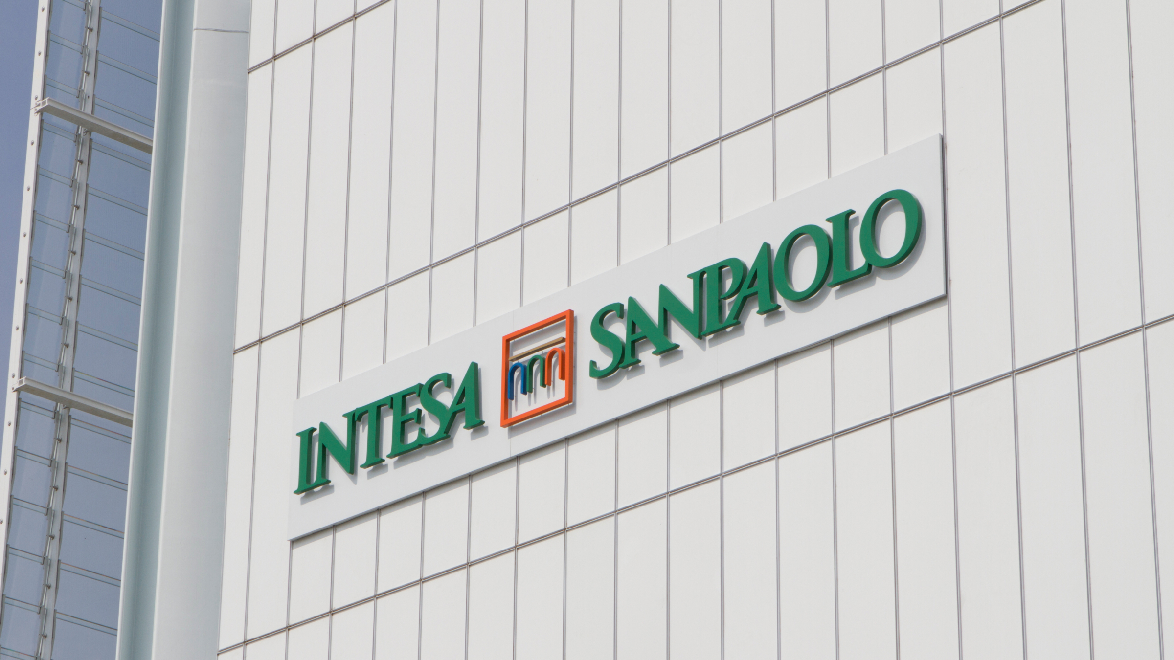 The Intesa Sanpaolo logo on building exterior.
