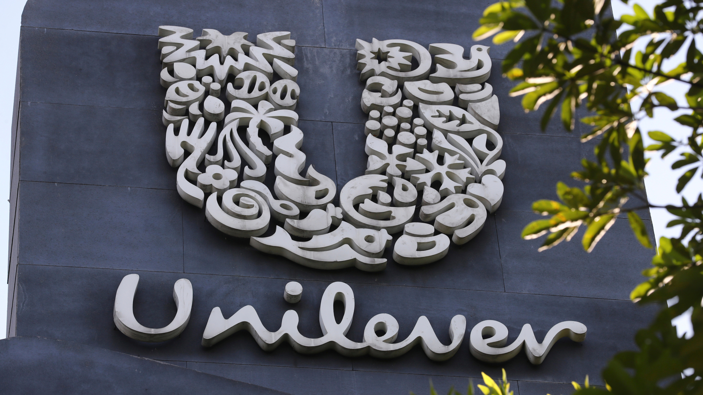 A Unilever logo is displayed outside the head office.