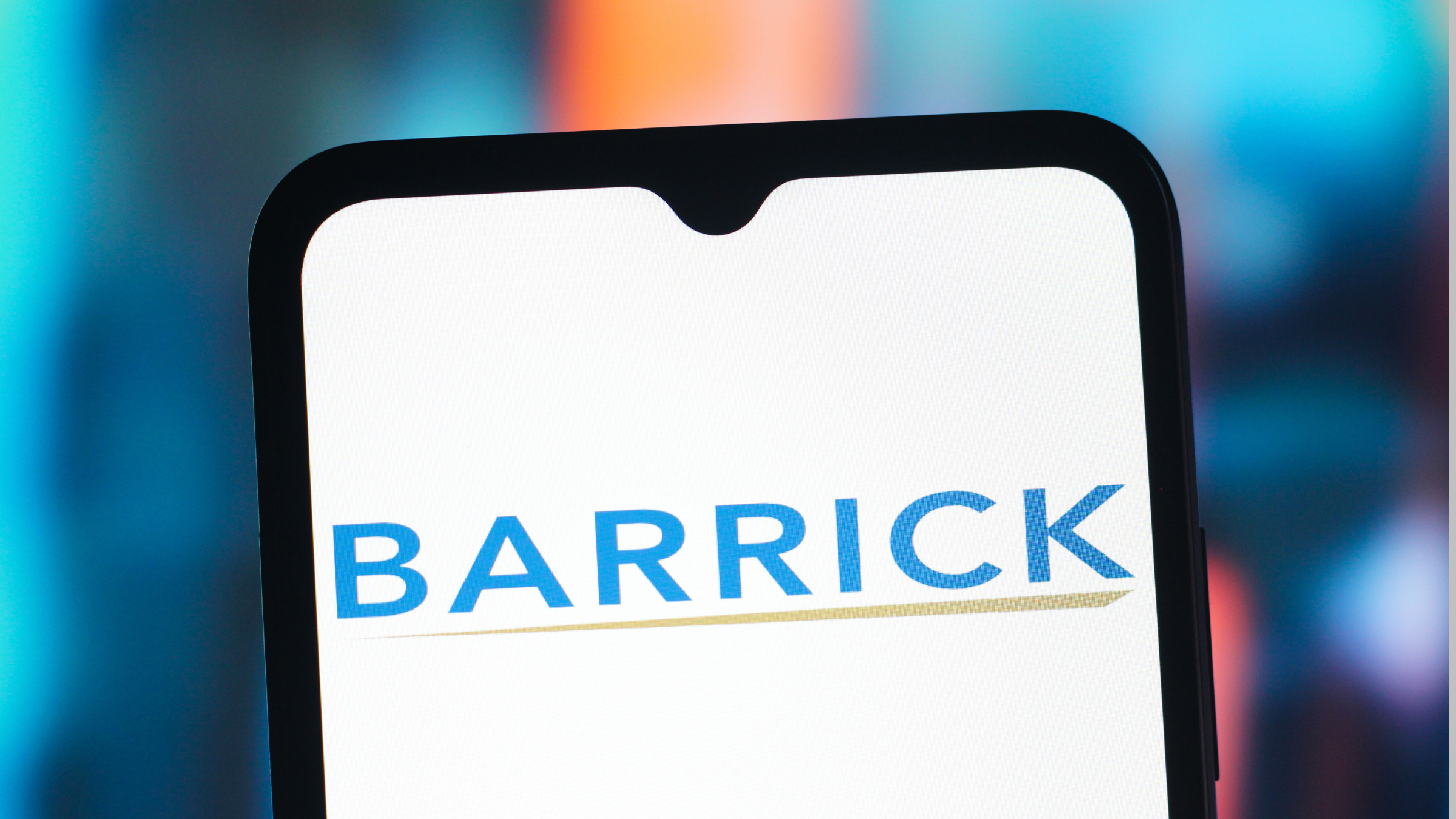 A Barrick Mining Corporation logo is seen displayed on a smartphone screen.