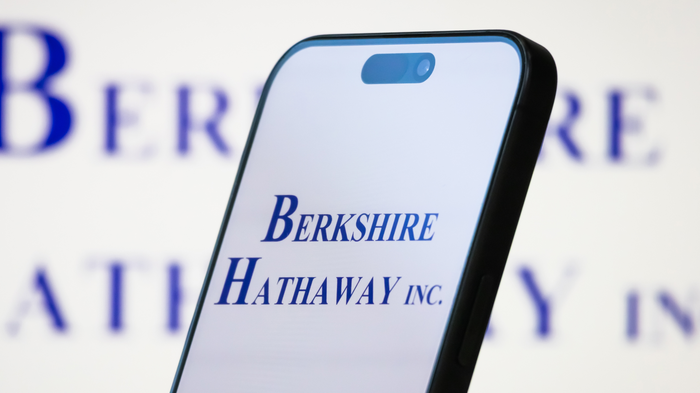 The Berkshire Hathaway Inc. is displayed on a smartphone screen.