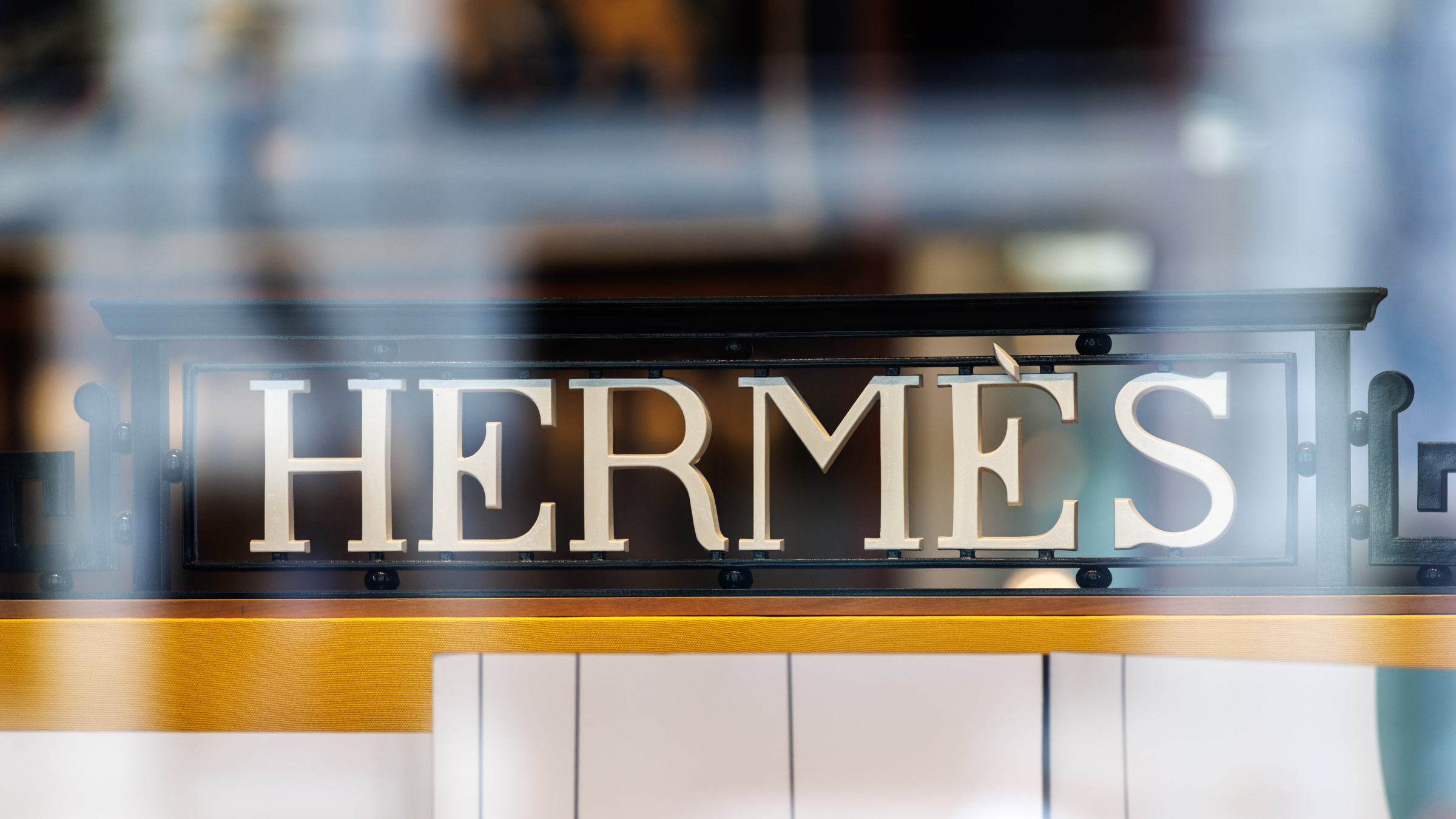 The Hermes brand logo and lettering can be seen on the fa&ccedil;ade of a company store.