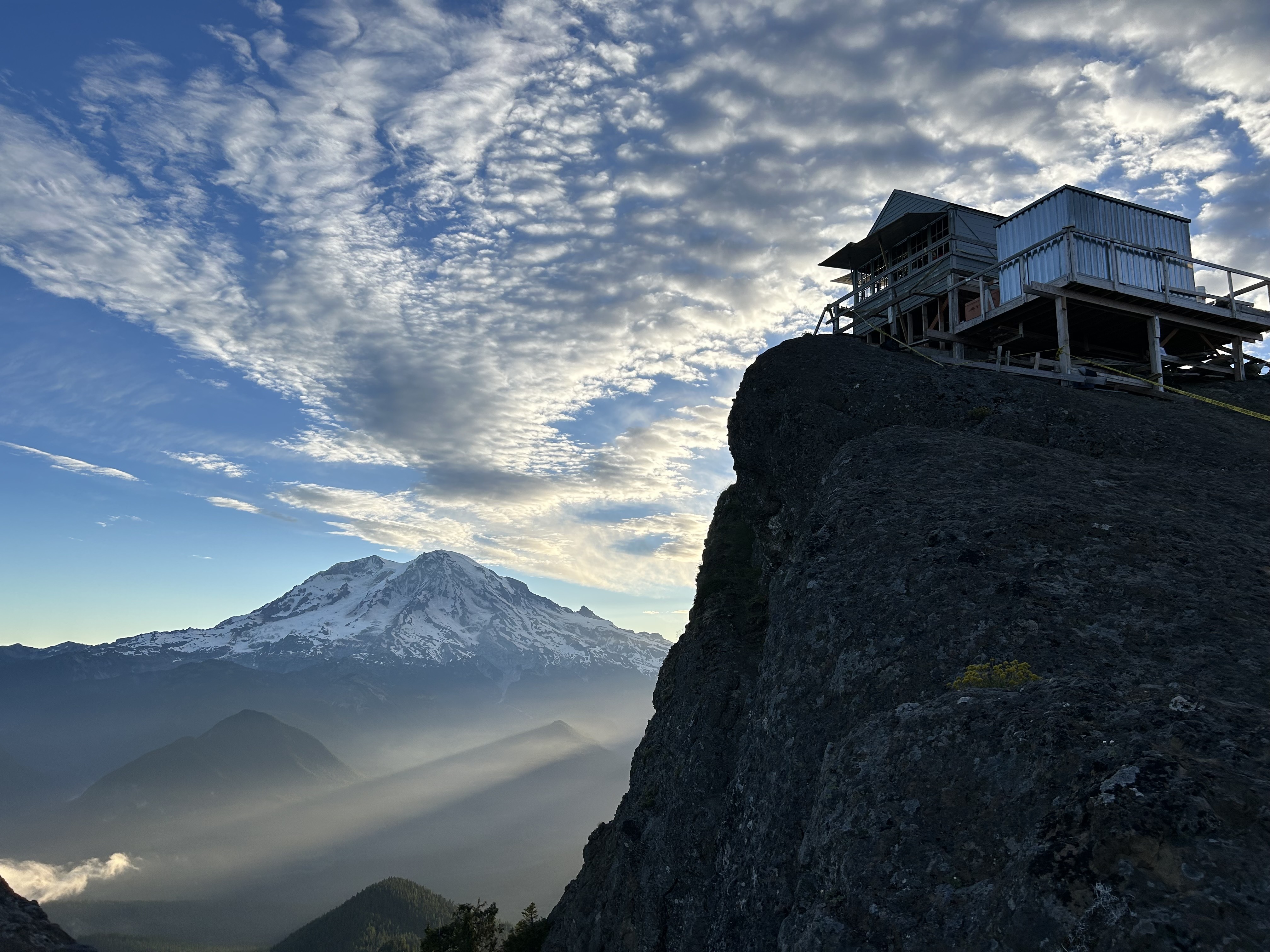 Perched on a rocky outcrop in Washington's Gifford Pinchot National Forest, the High Rock Lookout is one of the most photographed and popular scenic destinations in the Pacific Northwest, making it beloved by many, but also a target of vandals. Photograph June 2026.