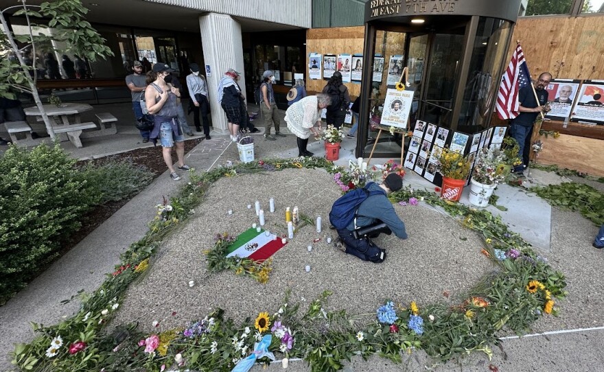 On the evening of July 10, 2026, people laid out flowers and candles in honor of Lorenzo Salgado Araujo, a man killed while being detained by ICE agents in Texas earlier in the week.