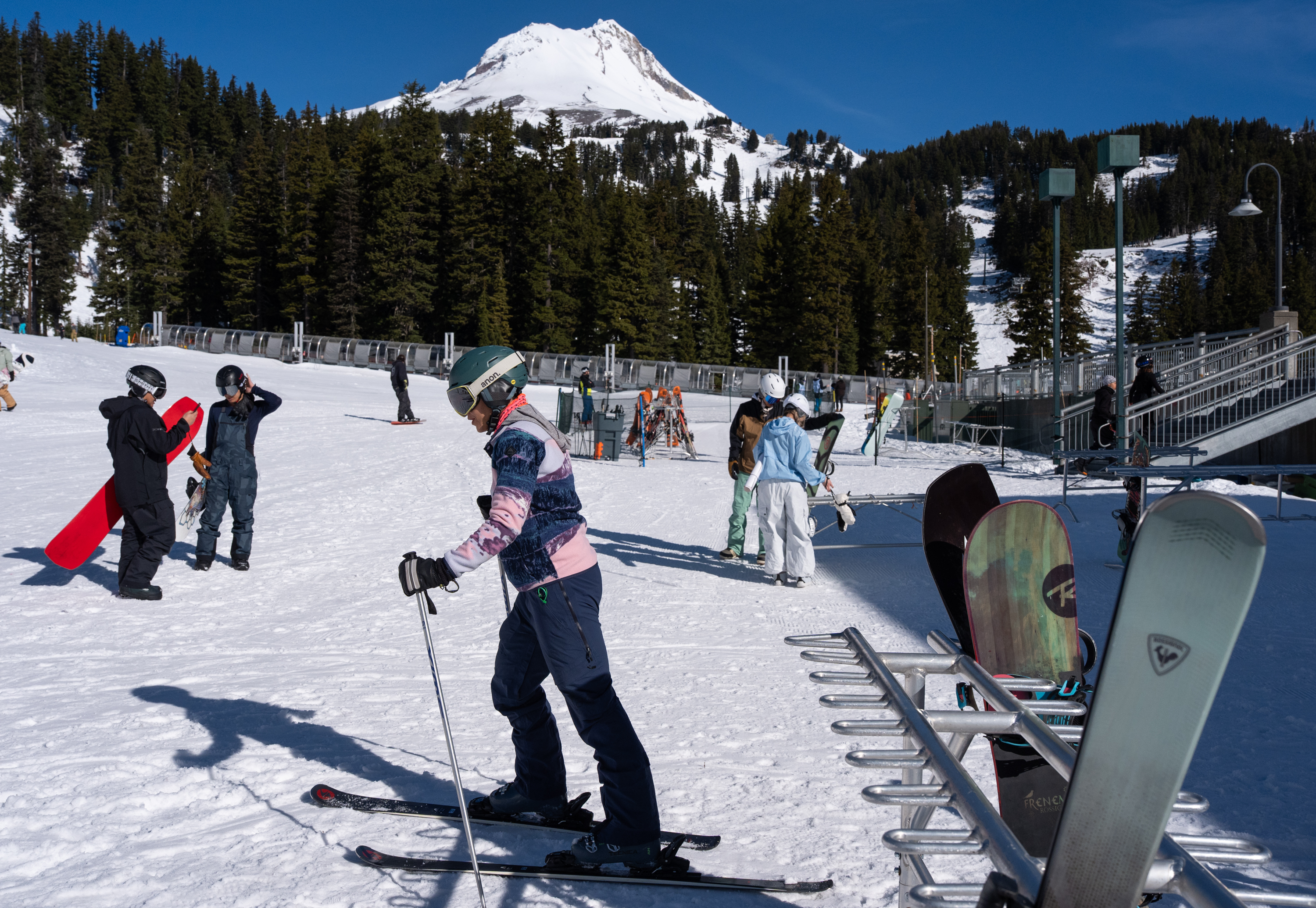 Hock Hockersmith, center, skis towards the ski lift. 