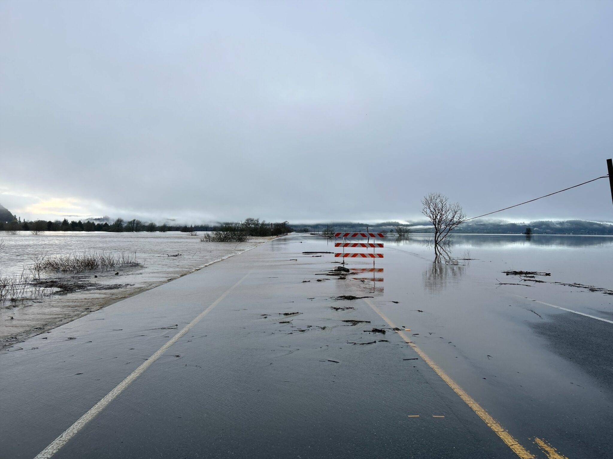 Flooding on Oregon Route 42 on March 17, 2025 near Coos Bay. Oregon Gov. Tina Kotek declared an emergency March 19 due to heavy rains which have washed out roads, cut power and caused at least one death.