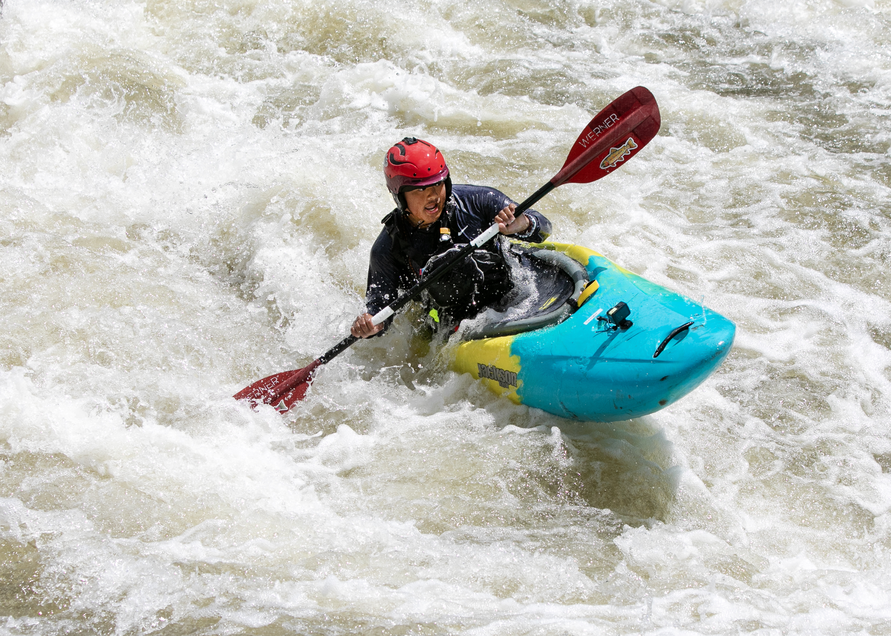 To’nehwan Jayden Dauz from the Hoopa Valley Tribe, 15, braces himself in a rapid on the Klamath River near where the Copco 1 and 2 dams once stood, June 22, 2025.  Dauz is a participant in Paddle Tribal Waters, a program that trained Indigenous youth for several years to be the first group of people to paddle the free-flowing Klamath from source to sea.