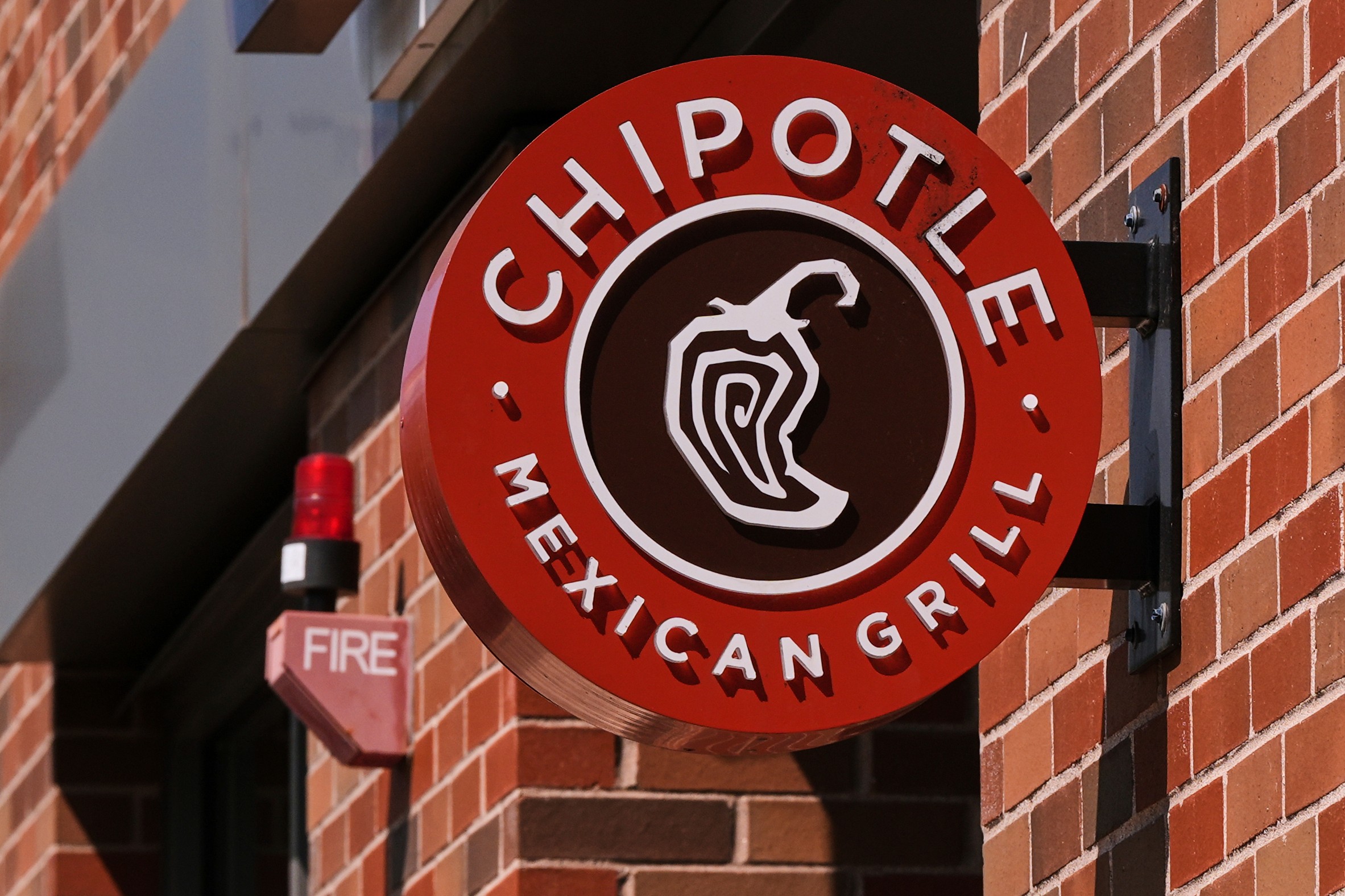 FILE - The Chipotle logo is displayed at a store, Aug. 13, 2025, in Newton, Mass.
