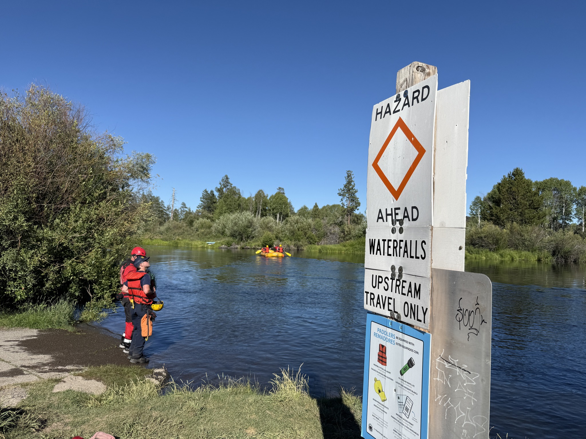 Rescuers stand in the Dillon Falls area near Bend, Ore., on July 19, 2025.