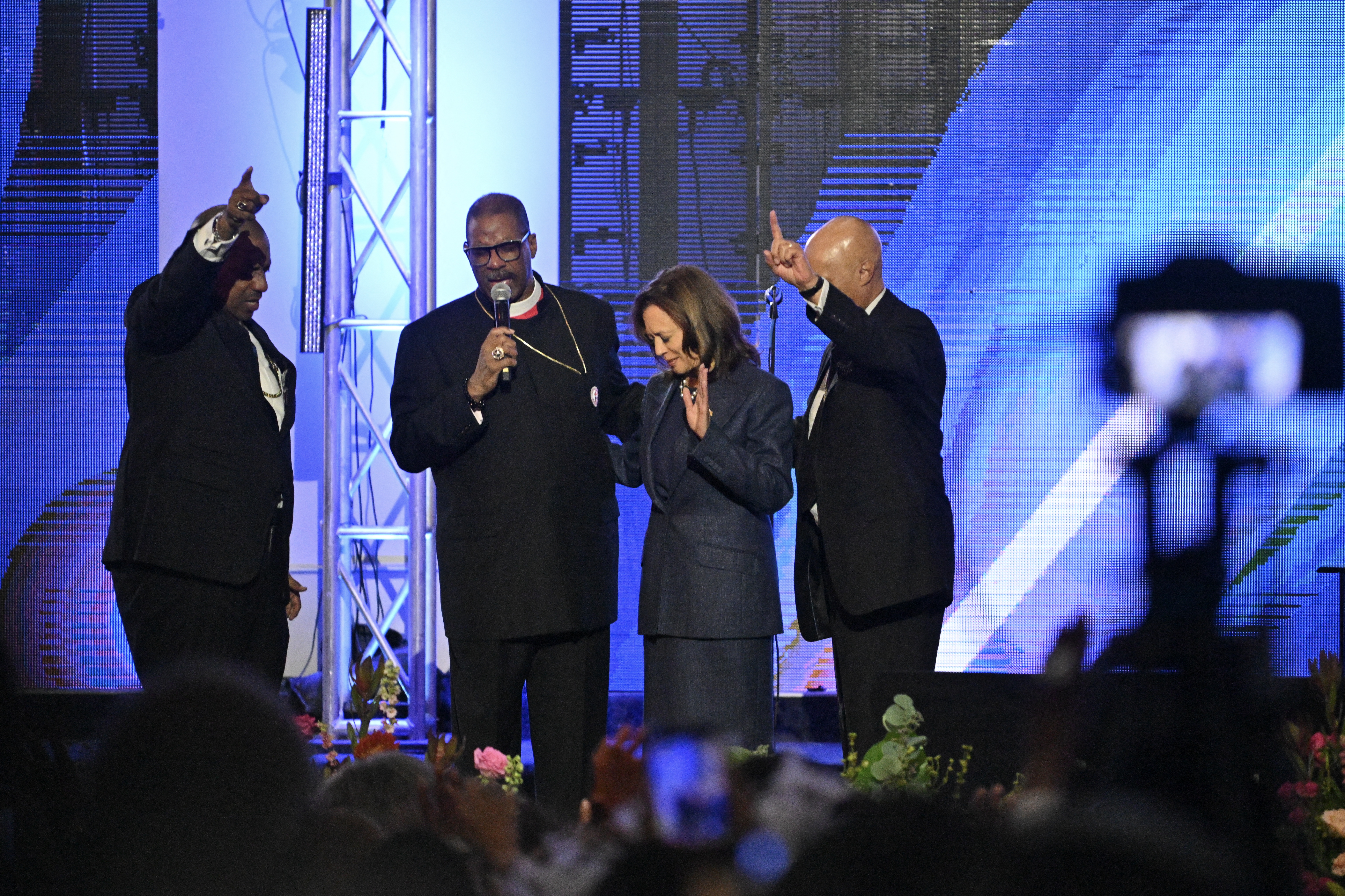 Vice President Harris prays with clergy members after speaking at Greater Emmanuel Institutional Church of God in Christ in Detroit on Nov. 3, 2024.