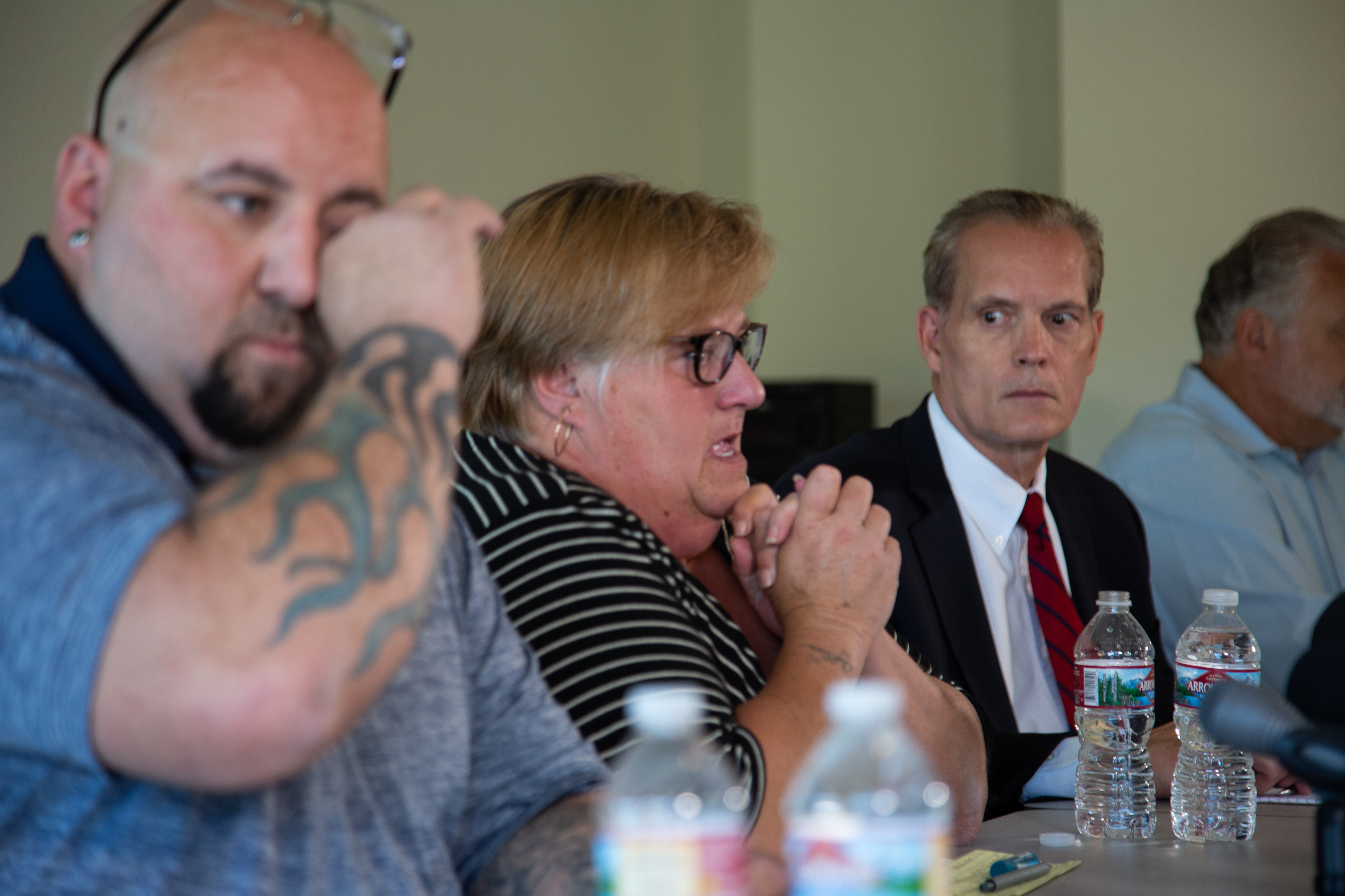 Sue Zawacky, center, talks while son Josh Shorthill, left, wipes tears and attorney Mark Lindquist looks on during a June news conference. The family announced June 24 they intend to sue Clark County over Jenoah Donald's death.