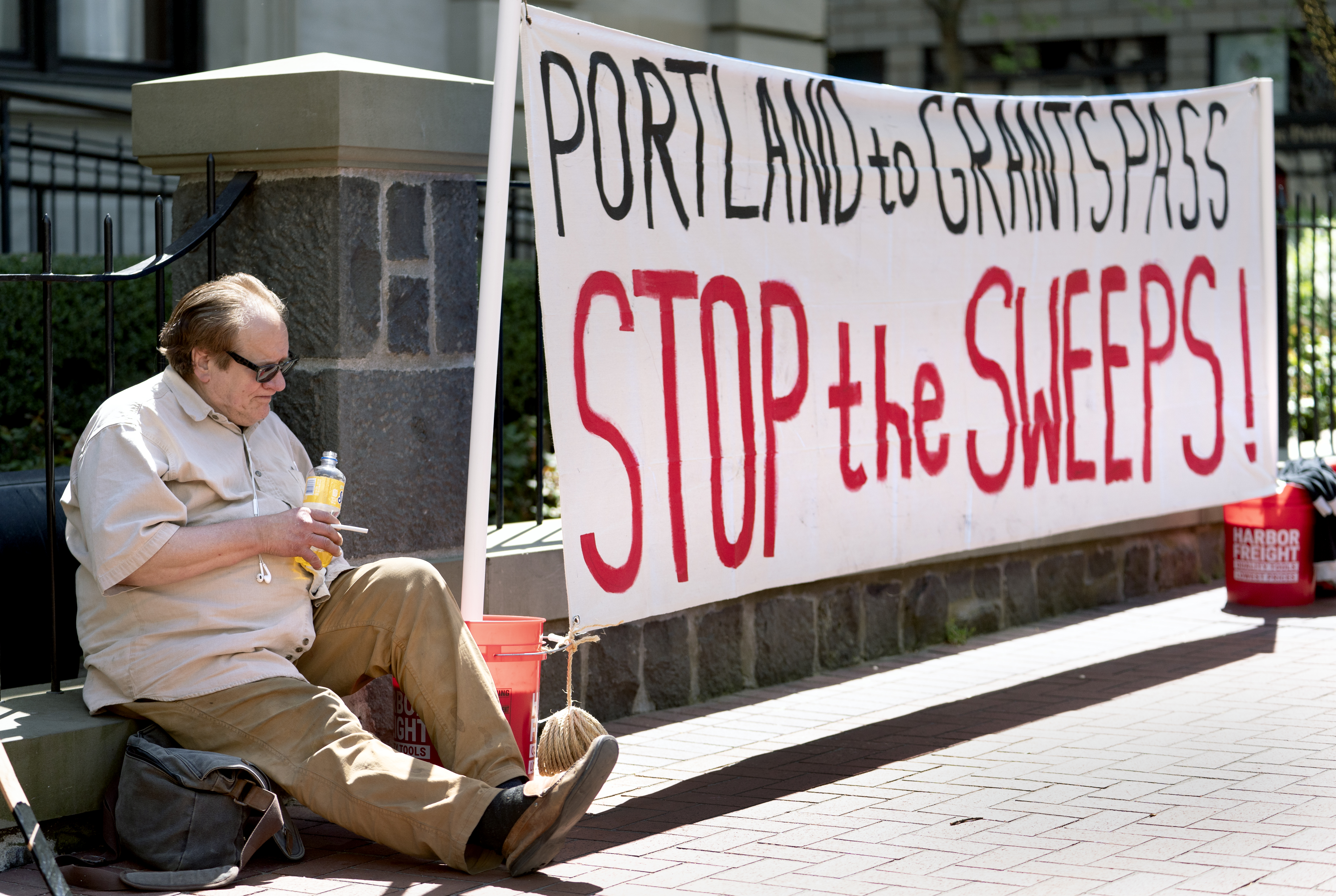 FILE: Jeff Liddicoat doesn’t like the term homeless — “I live outside,” he says, while attending an event held in at Pioneer Courthouse in Portland, Ore., April 22, 2024, organized by Stop The Sweeps PDX. 
