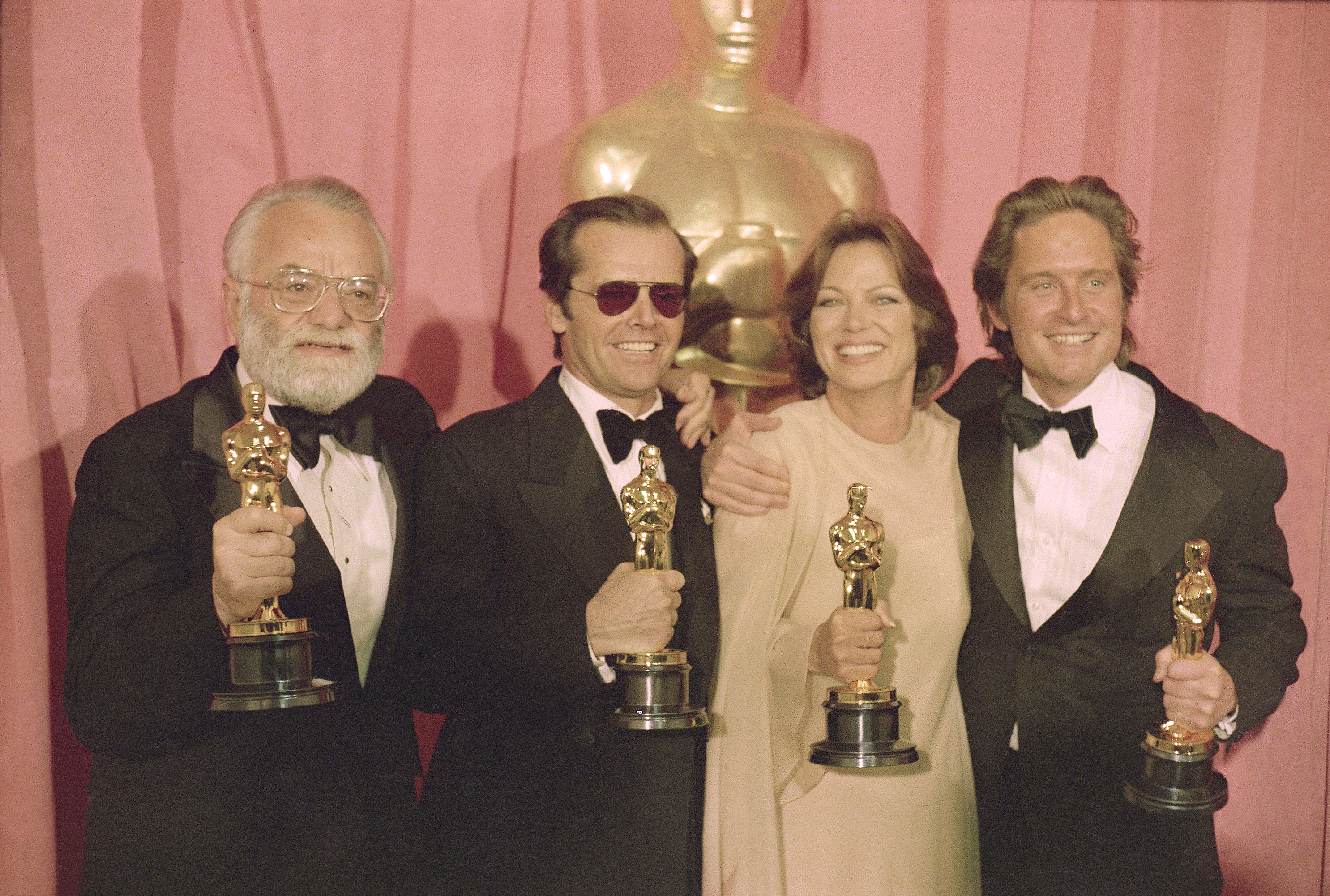 FILE - Members of the cast and crew of  "One Flew Over the Cuckoo's Nest," winners of the Oscars for best actor, best actress and best picture, from left, co-producer Saul Zaentz, actor Jack Nicholson, actress Louise Fletcher and co-producer Michael Douglas, are shown at the Oscars on March 30, 1976.