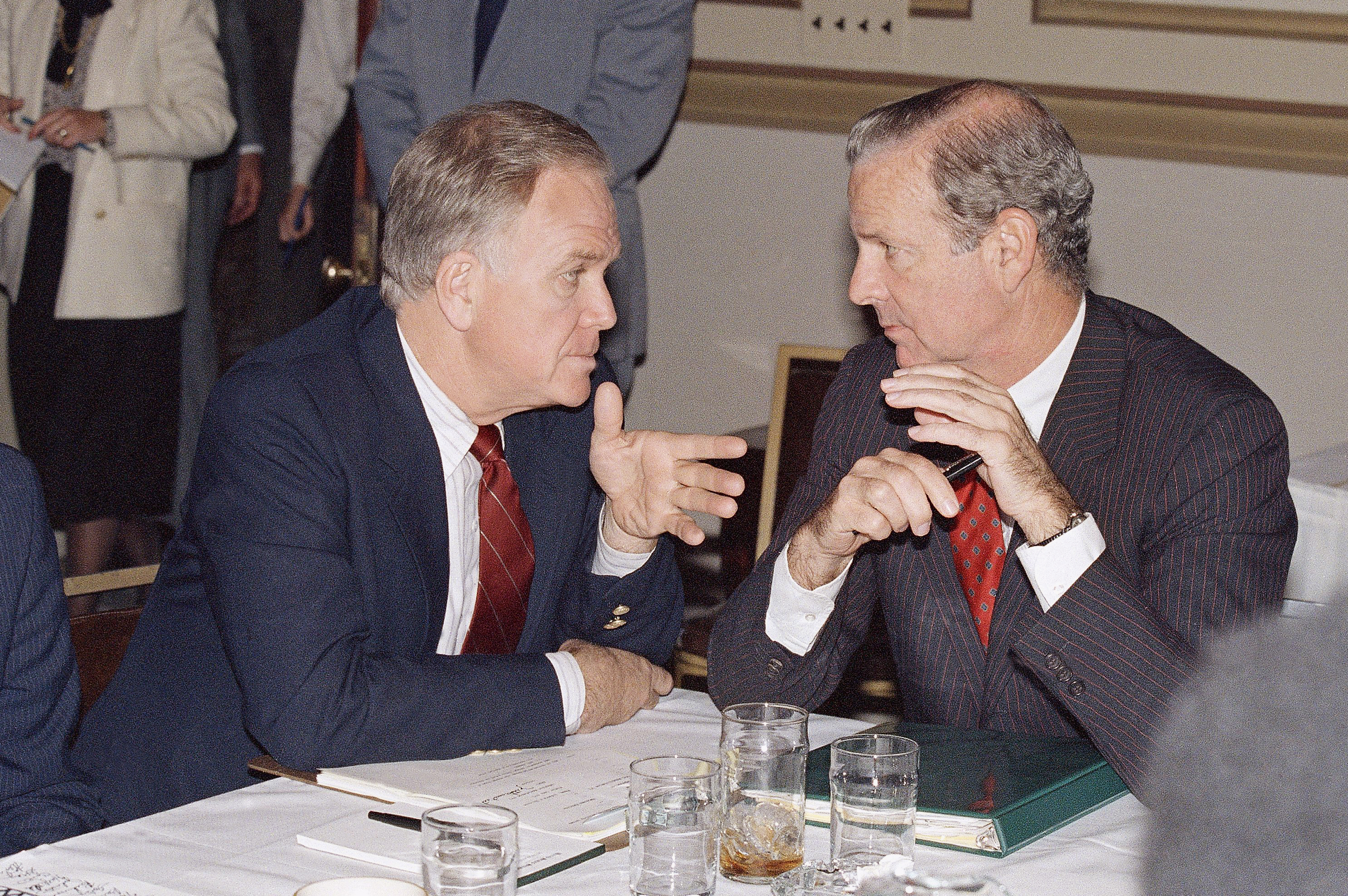 Treasury Secretary James Baker, right, huddles with Sen. Bob Packwood, R-Ore., on Capitol Hill in Washington, Monday, Nov. 2, 1987, during a session of administration and Congressional members working on the budget cuts.