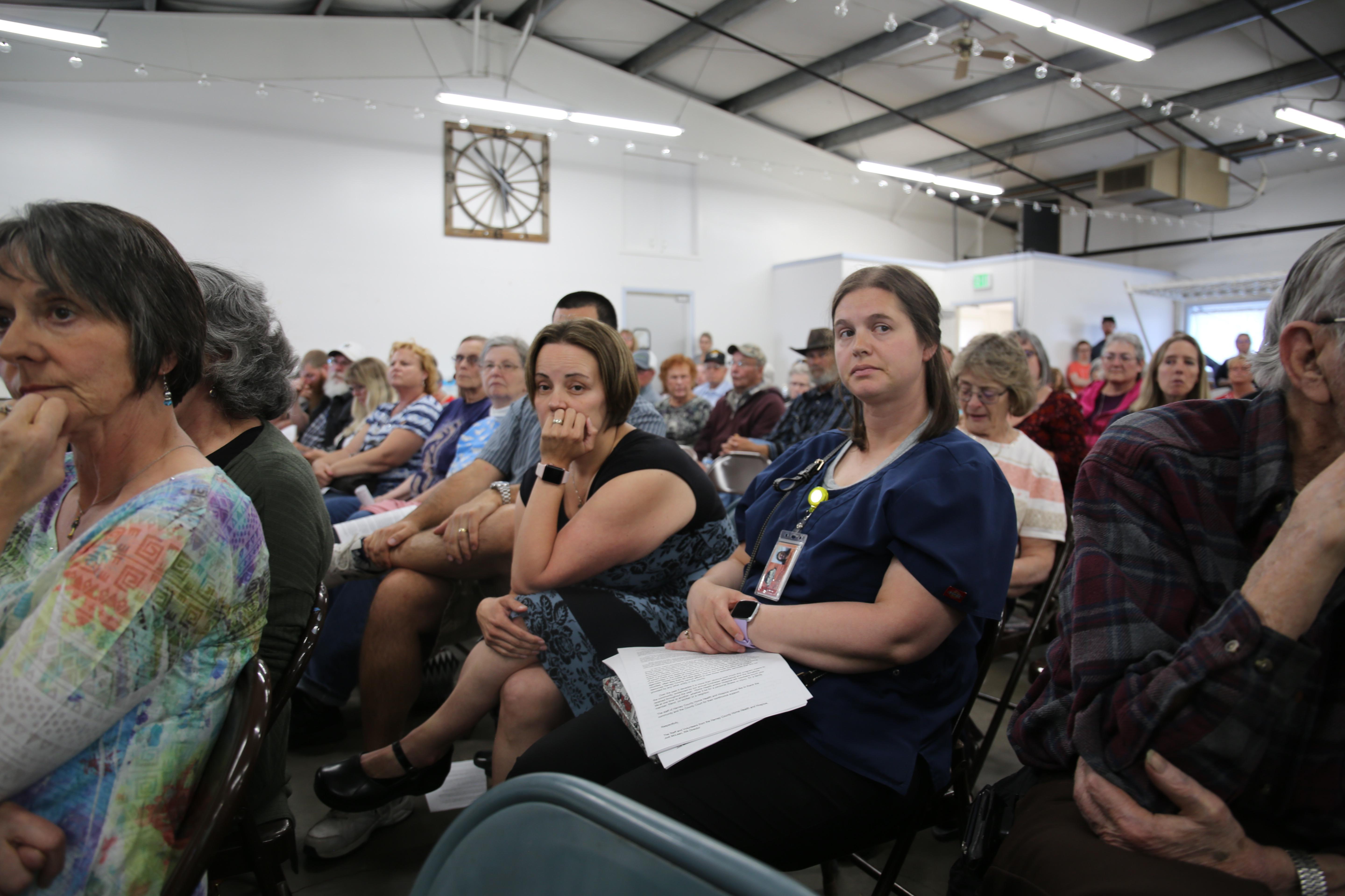 Harney County Health Director Dr. Sarah Laiosa, center, listens at a meeting on May 7, 2019. Several patients stood up to thank her, and urge the county commission not to defund a clinic and other public health programs. 