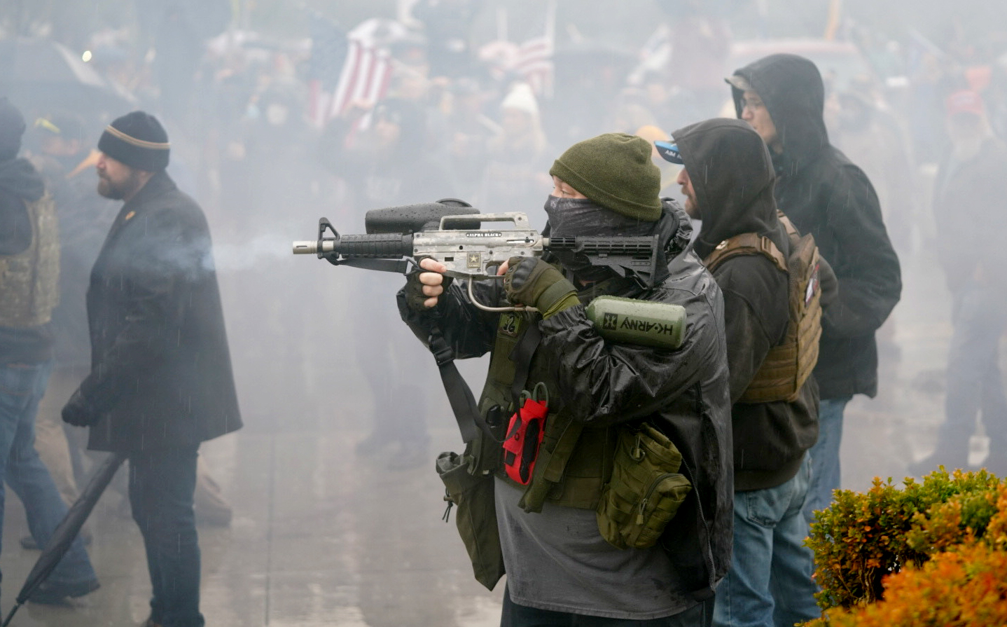 Far-right demonstrators clash with police and counter-demonstrators during a demonstration against what they erroneously claim was a fraudulent presidential election on Jan. 6, 2021, in Salem, Ore. Lawmakers have delayed plans to gather in person next week for the start of the 2021 legislative session out of an abundance of caution. 