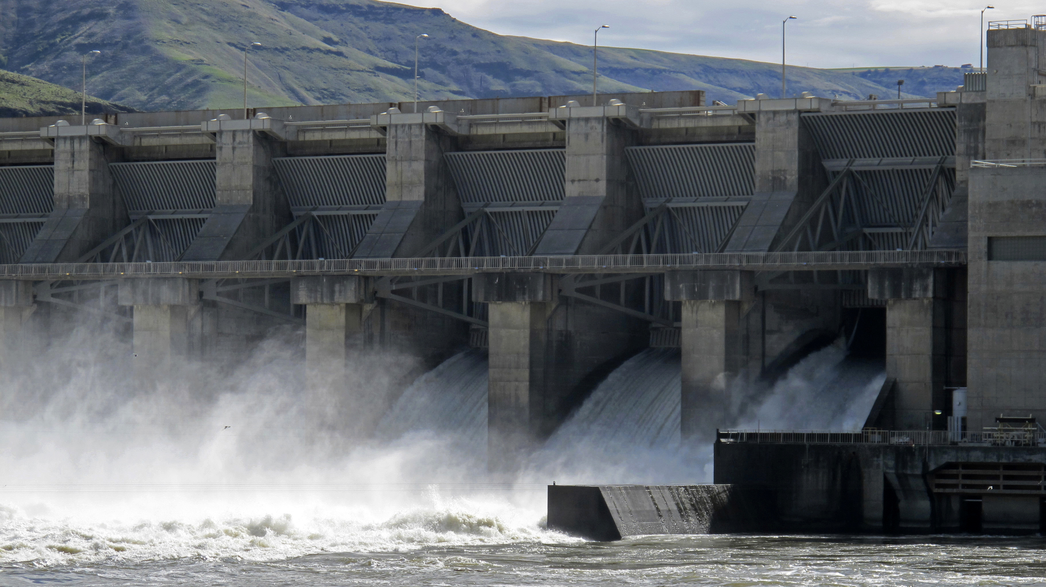 FILE - Water moves through a spillway of the Lower Granite Dam on the Snake River near Almota, Wash., April 11, 2018.