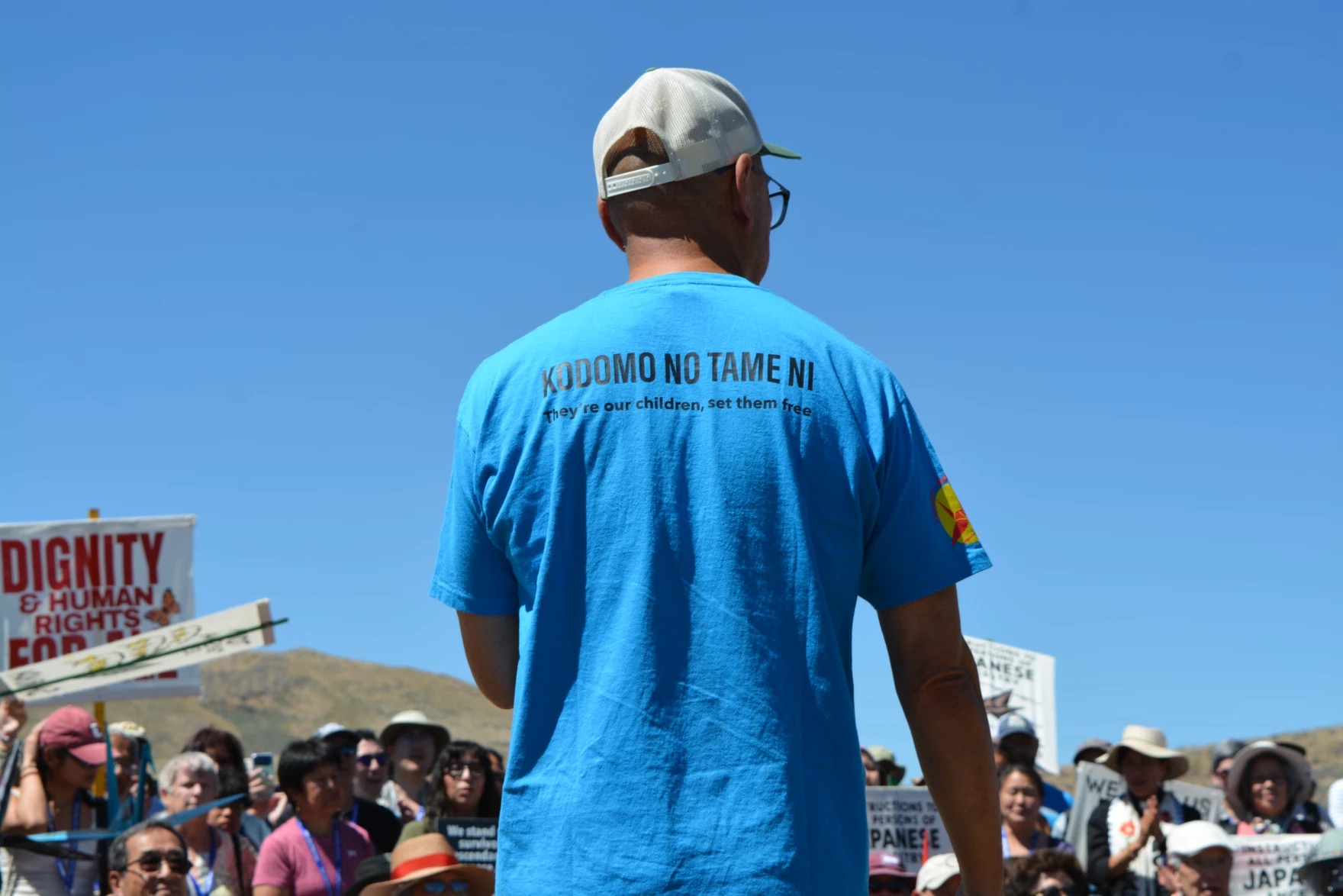A member of Tsuru for Solidarity leads chants for freedom at the Tule Lake pilgrimage, July 4, 2026.