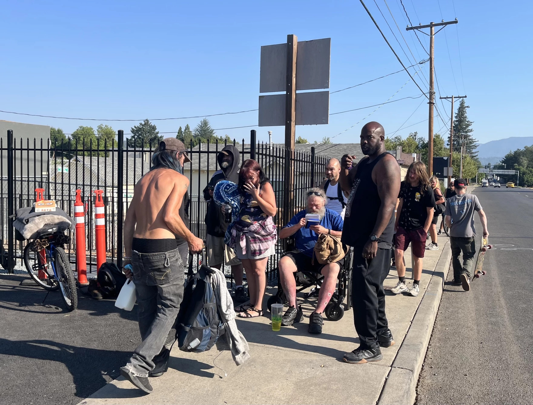 Homeless folks line up outside Parker's Place Village on Aug, 4, 2026, hoping to get one of the last 26 beds.