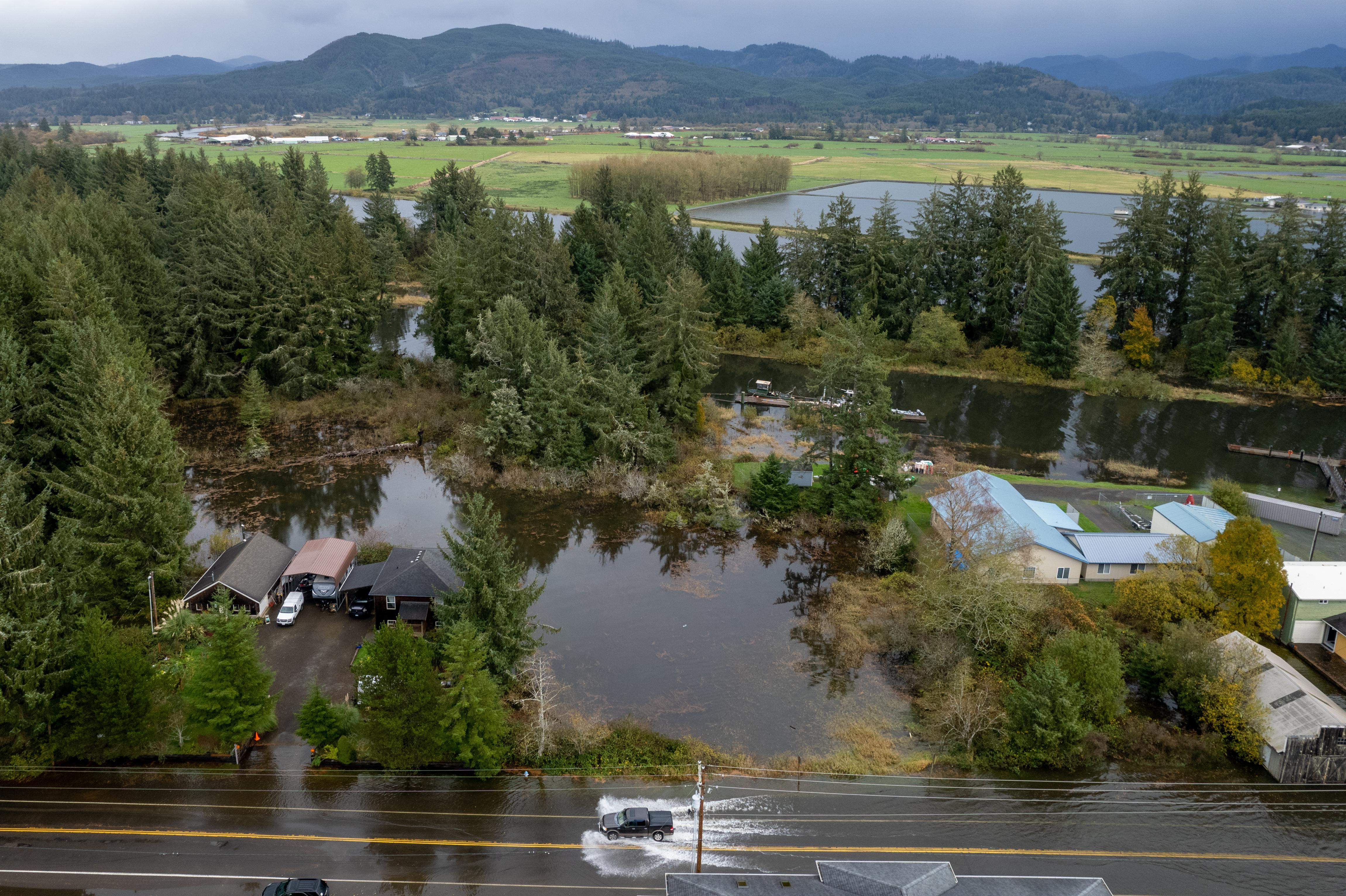 Vehicles were wading to get through the intersection of highway 101 and 7th Street. Taken at the peak of the King Tide Saturday Nov. 6, 2021.