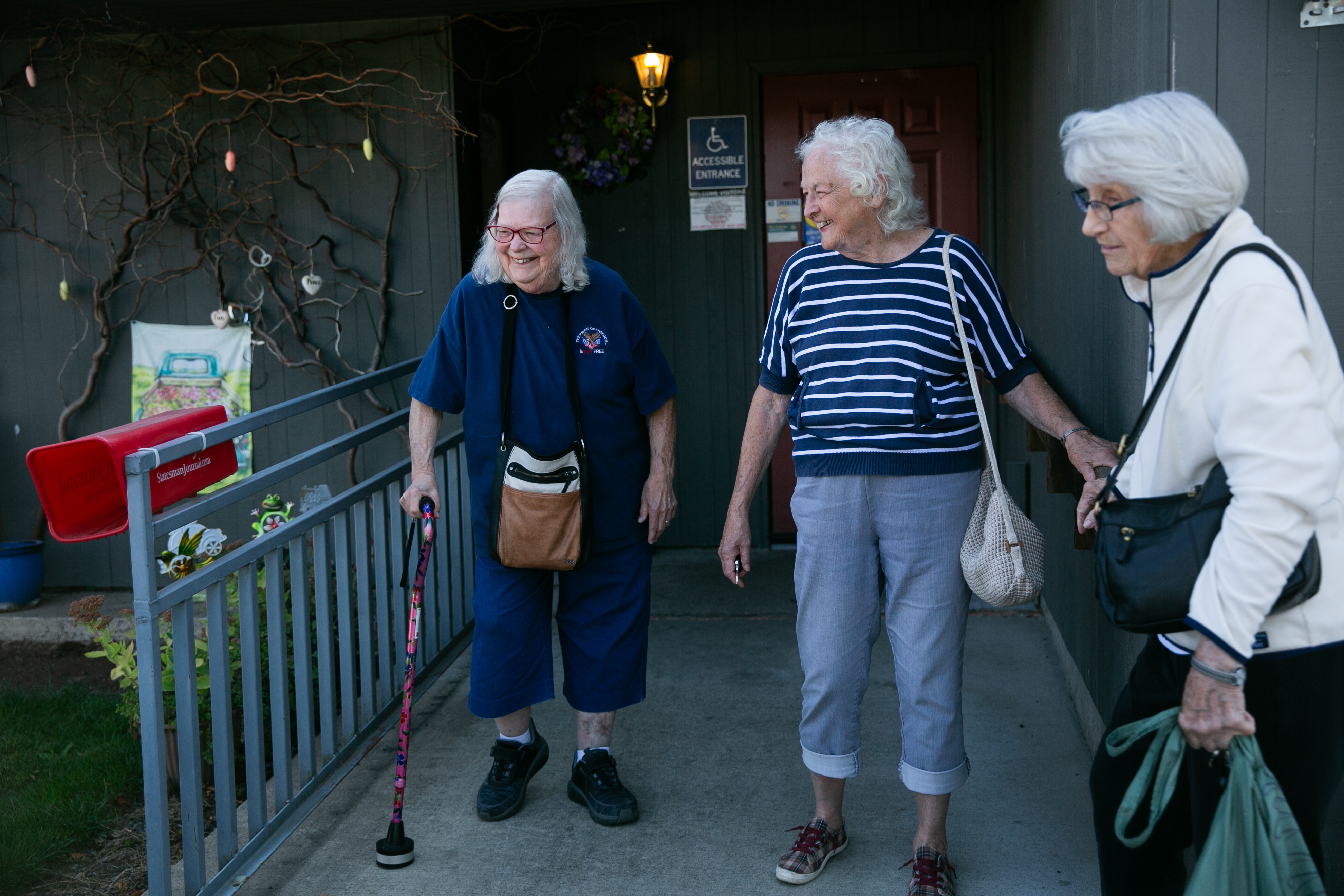 (Left to right) Ann Cape, Betty Schallhorn and Marjorie Taray leave a social event at the Senior Community Center in Monmouth. The number of Oregonians over 65 outnumber the number of children in the state.