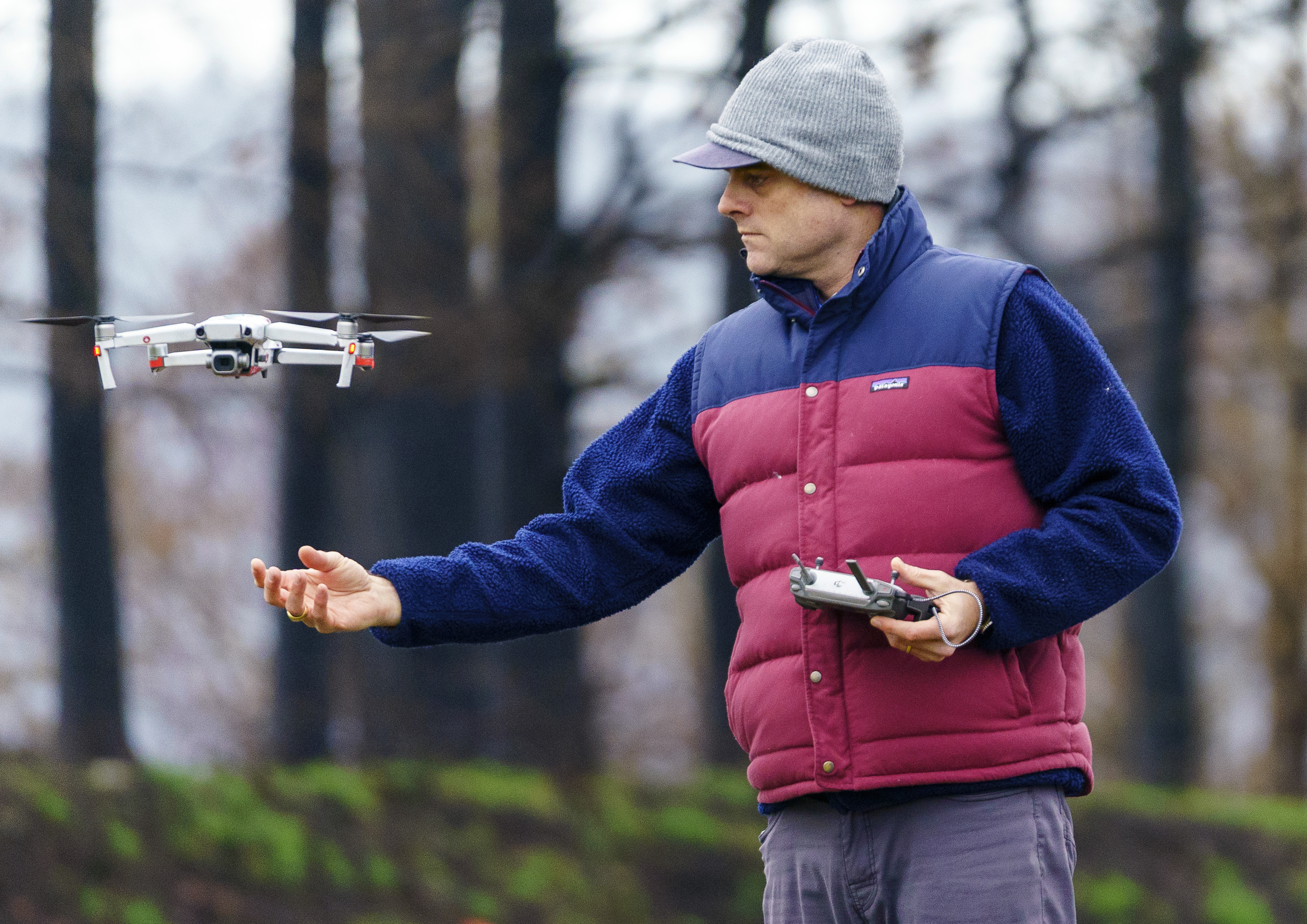 Ralph Bloemers has been documenting the areas affected by the 2020 Santiam wildfires. He retrieves a drone after photographing a heavily burned area, Feb. 26, 2021, and will compare the images to those he shot previously see how the area is recovering.