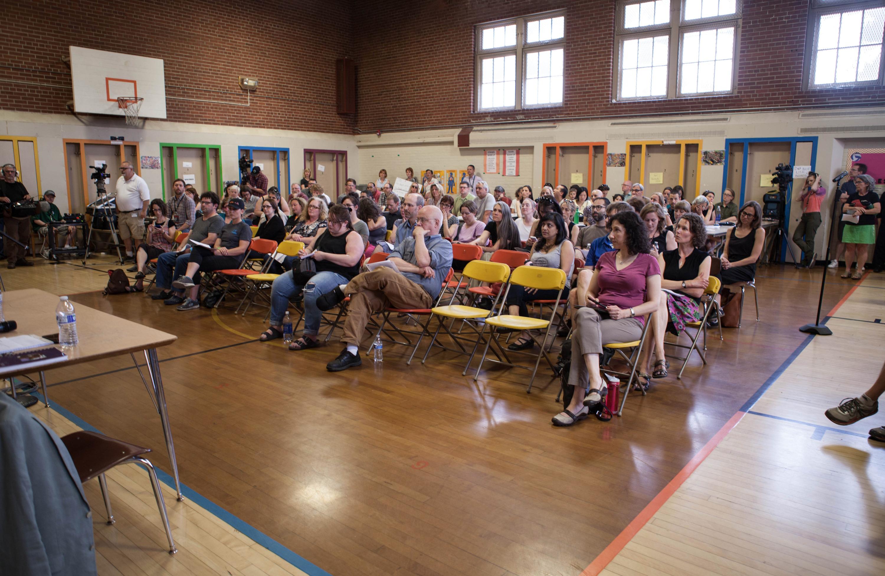 Portland Public Schools Superintendent Carole Smith responds to a parent asking her to resign during a meeting at Rose City Park school in Portland, Oregon. “Does that fire alarm work? Is there asbestos in those vents? Do you want to tell us what works and doesn’t work in our school?” demanded Rob Neild, who has one child at Rose City Park.