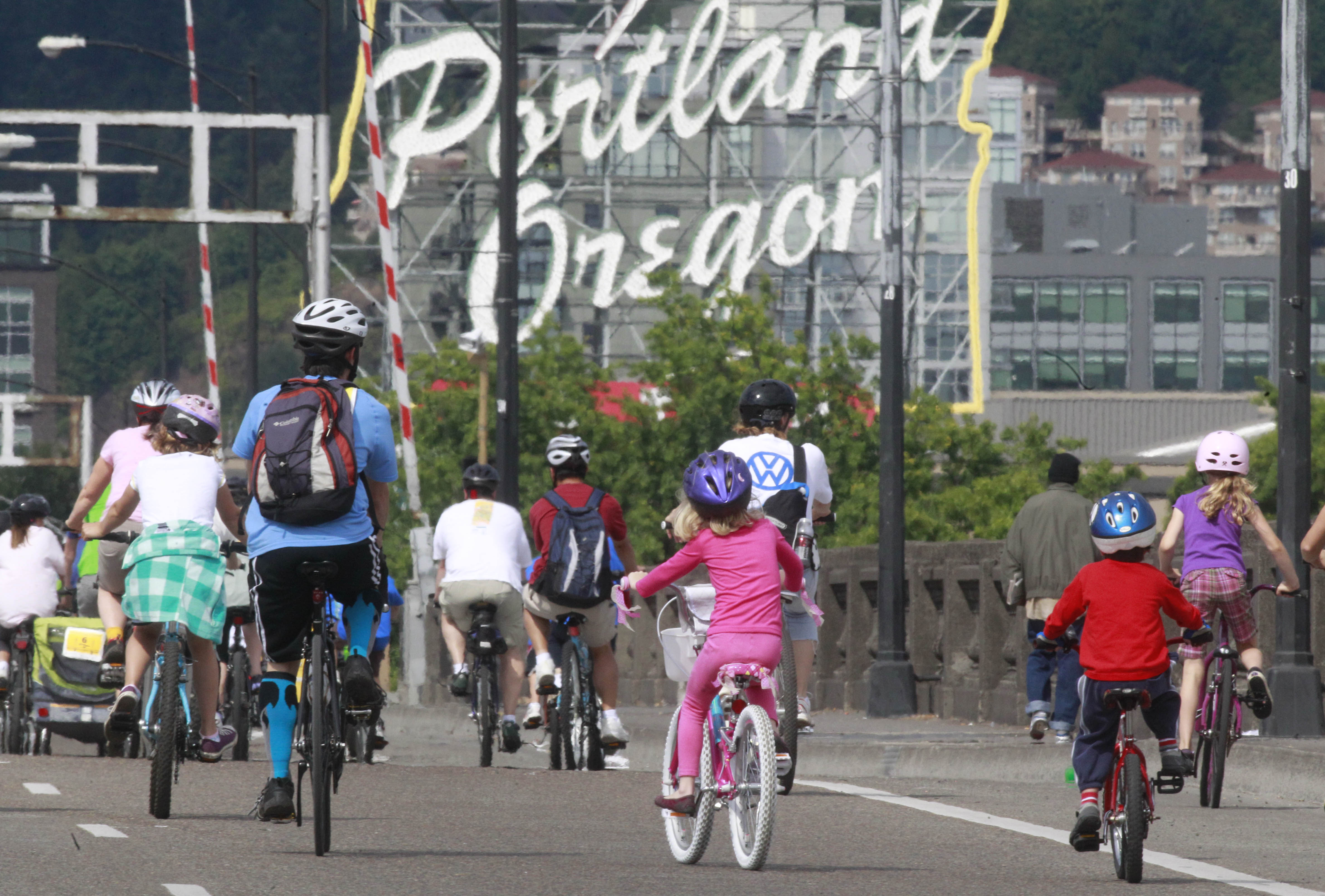 FILE - Bicyclists cross the Fremont Bridge during the Providence Bridge Pedal Sunday, Aug. 14, 2011, in downtown Portland, Ore.